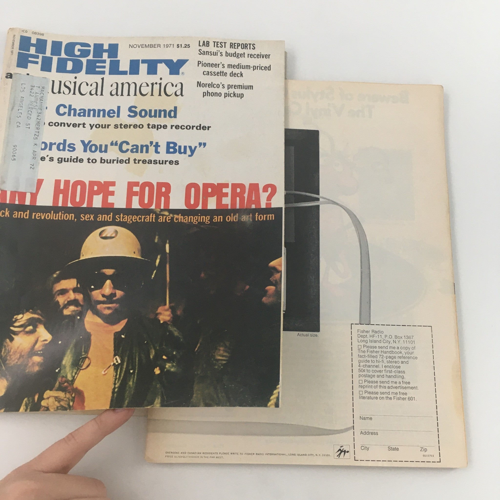 The November 1971 issue of High Fidelity magazine partially opened, displaying the cover featuring Pioneer's Medium-Priced Cassette Deck and additional content related to audio technology and music culture.