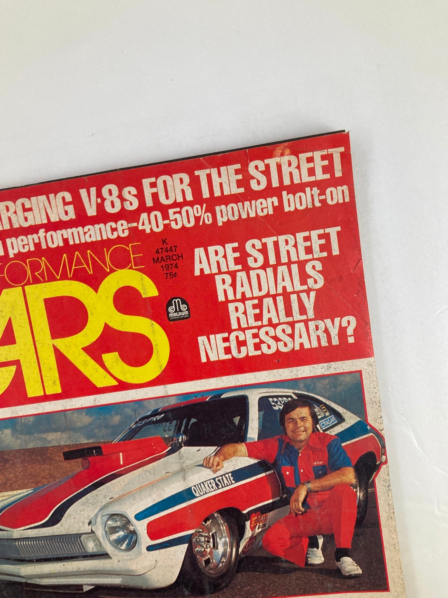 Close-up of the VTG Cars Magazine March 1974 Vol 17 #3 cover highlighting 'Turbocharging V-8s for the Street', featuring a striking image of a race car and an automotive enthusiast, with an eye-catching title design.