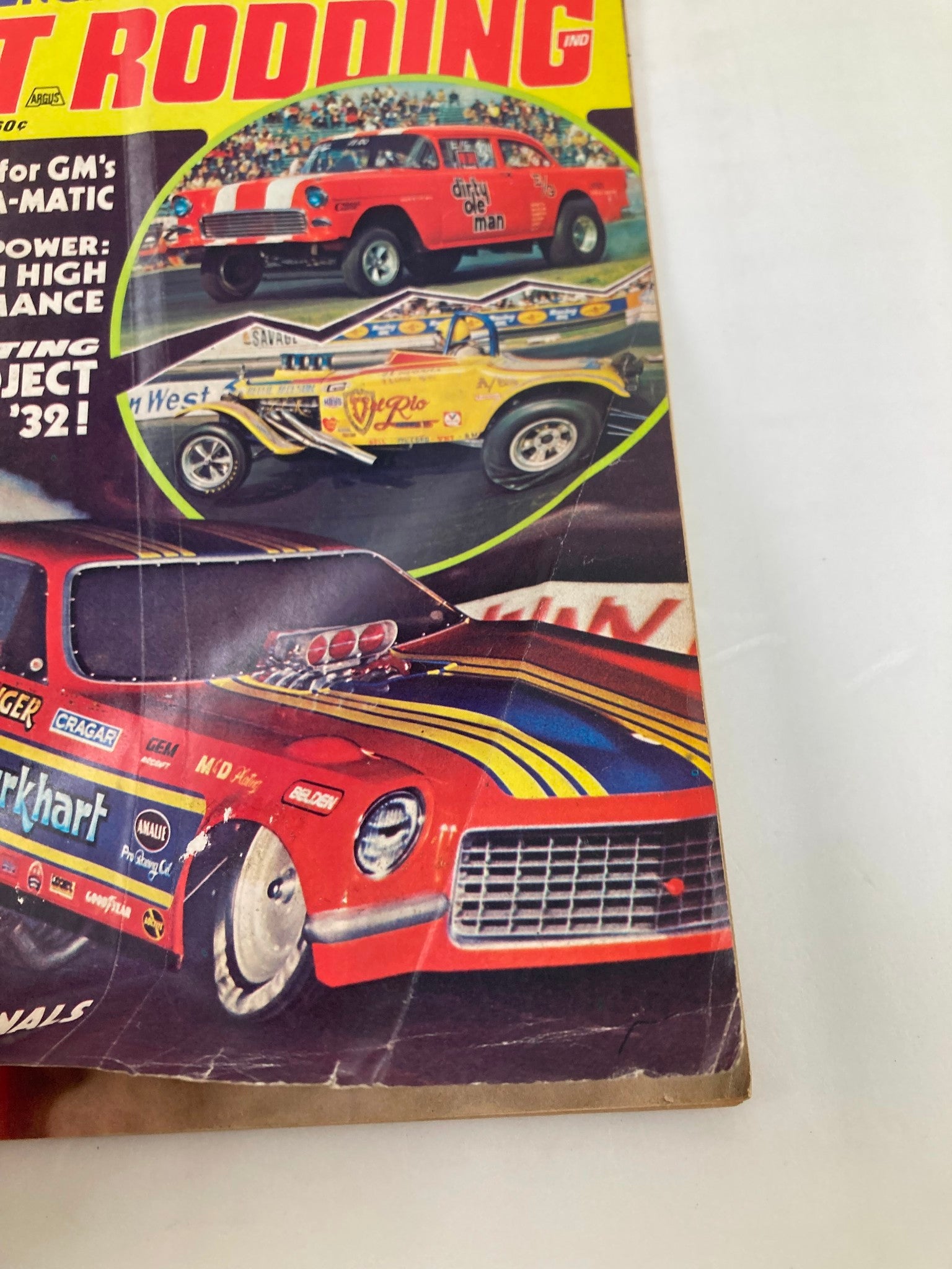 Detailed view of VTG Hot Rodding Magazine February 1974 Vol 13 #2 cover highlighting the drag racing cars and the colorful graphics.