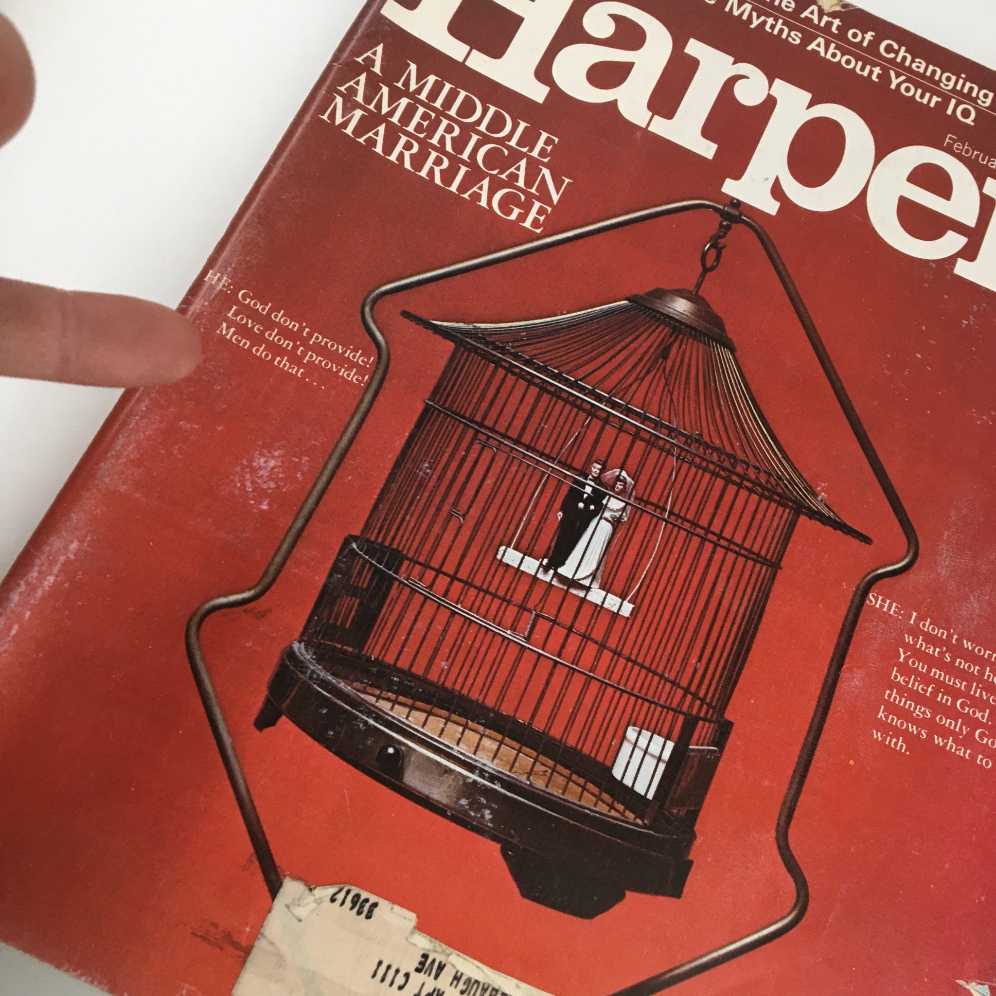 Close-up of the cover of VTG Harper's Magazine February 1973 showing the phrase 'God don’t provide! Love don’t provide! Men do that...' related to the article 'A Middle American Marriage'.