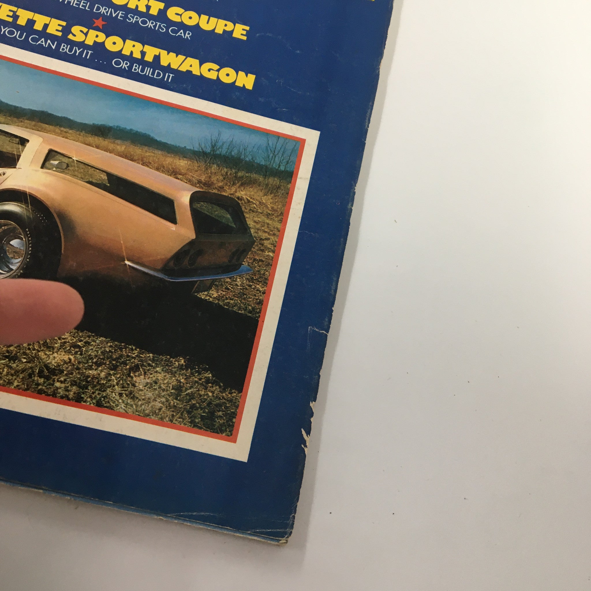 Close-up view of the cover of VTG Car and Driver Magazine July 1972, highlighting 'Corvette Sportwagon' and showcasing a detailed image of a sports car.