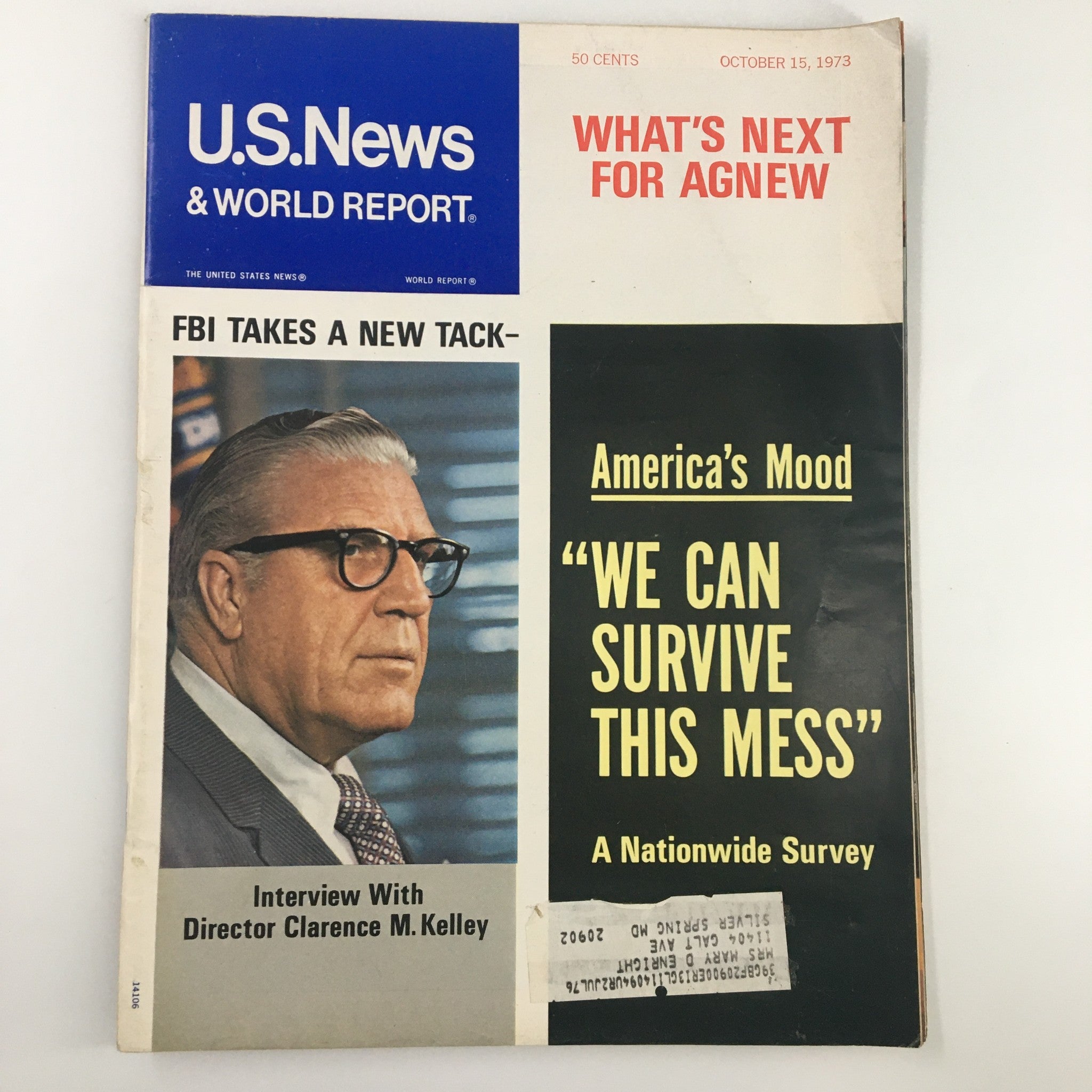 Cover of US News & World Report Magazine from October 15, 1973, featuring an interview with Clarence M. Kelley. The cover highlights themes of America's mood during that era, with bold text stating 'We Can Survive This Mess' and a visual representation of the social climate.