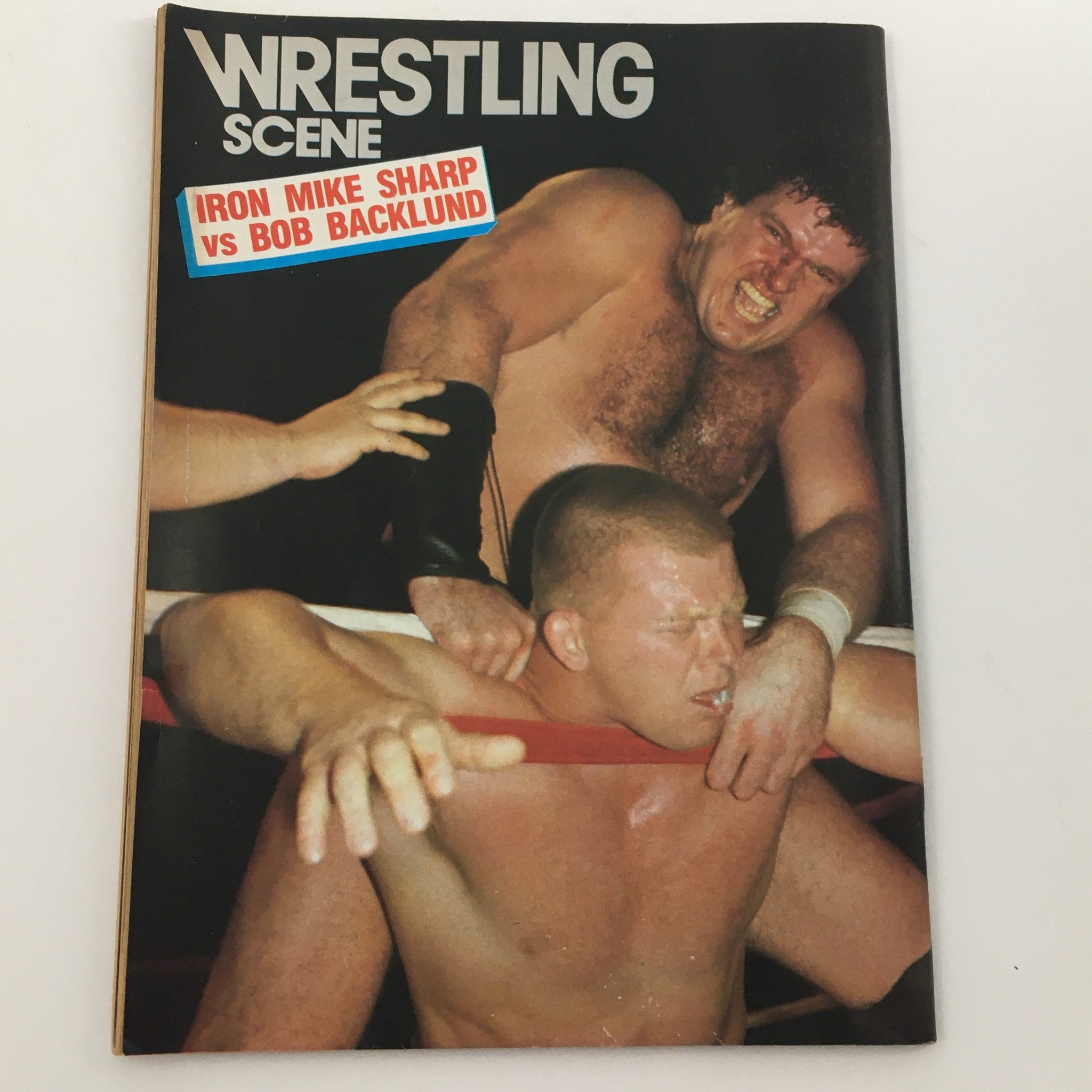Cover of Wrestling Scene Magazine highlighting a wrestling match between Iron Mike Sharp and Bob Backlund, as part of the April 1985 #21 issue.