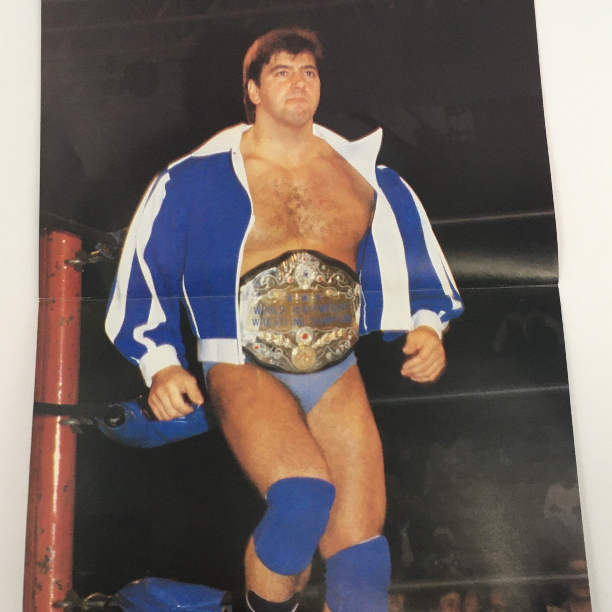 Wrestling Scene Magazine April 1985 #21 featuring a wrestler in a blue and white outfit with a championship belt, representing an iconic era in professional wrestling.