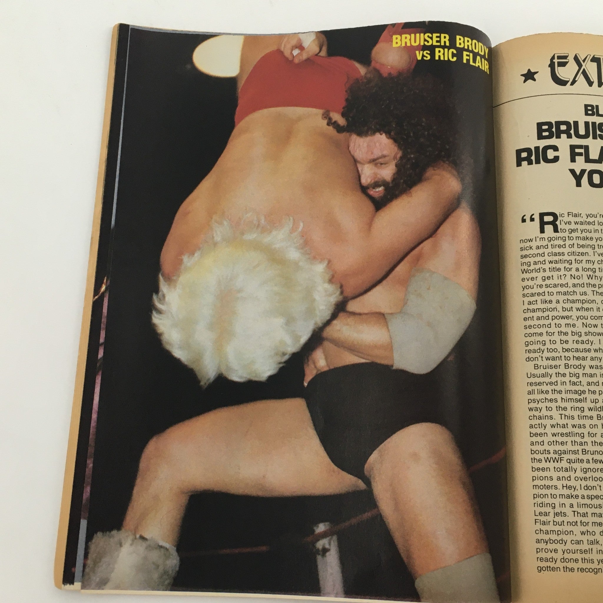 Wrestling Scene Magazine April 1985 #21 displaying a matchup between Bruiser Brody and Ric Flair, capturing the excitement of classic wrestling bouts.