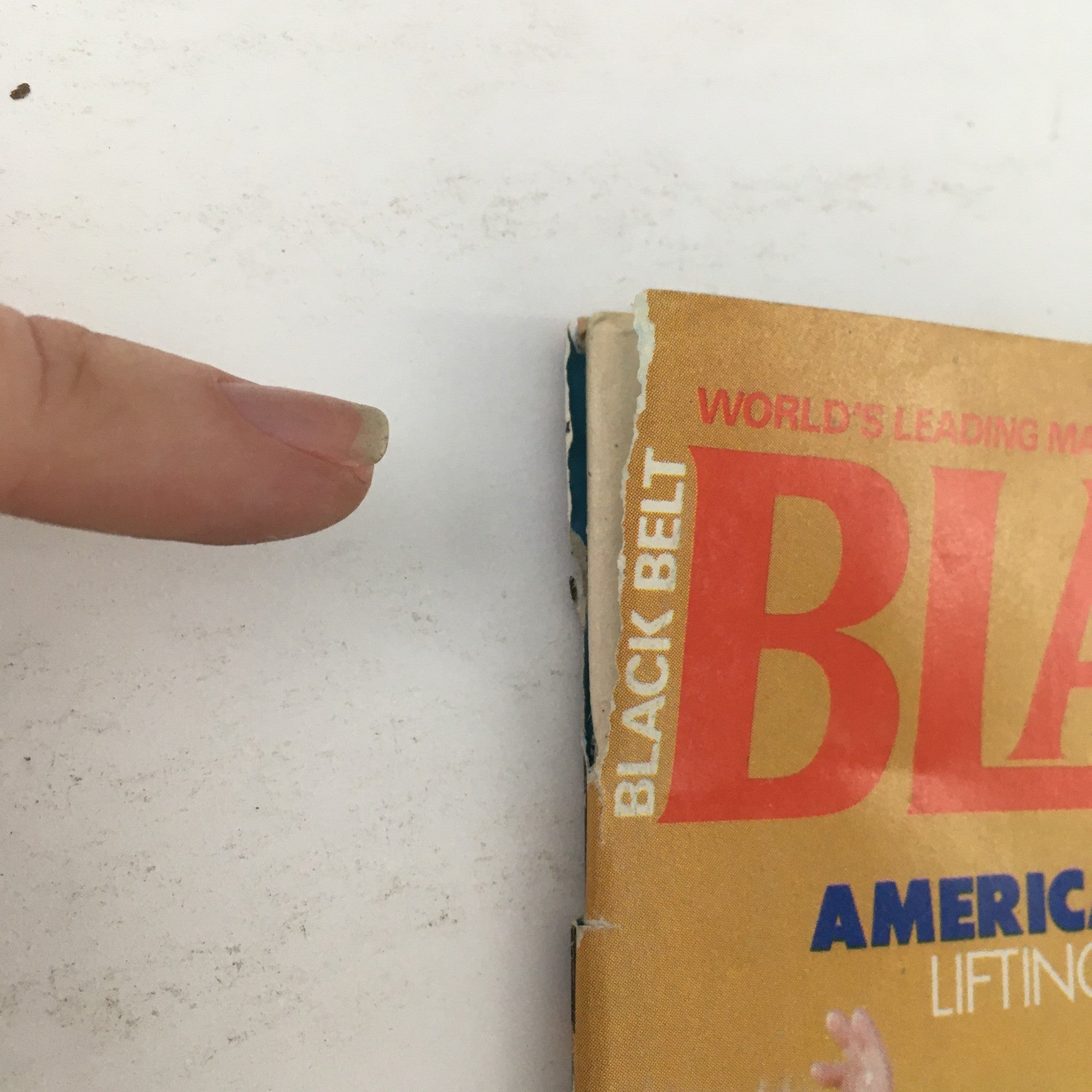 Cover edge of Black Belt Magazine December 1979 Vol 17 #12 showing wear and tear, highlighting the vintage nature of this collectible magazine.