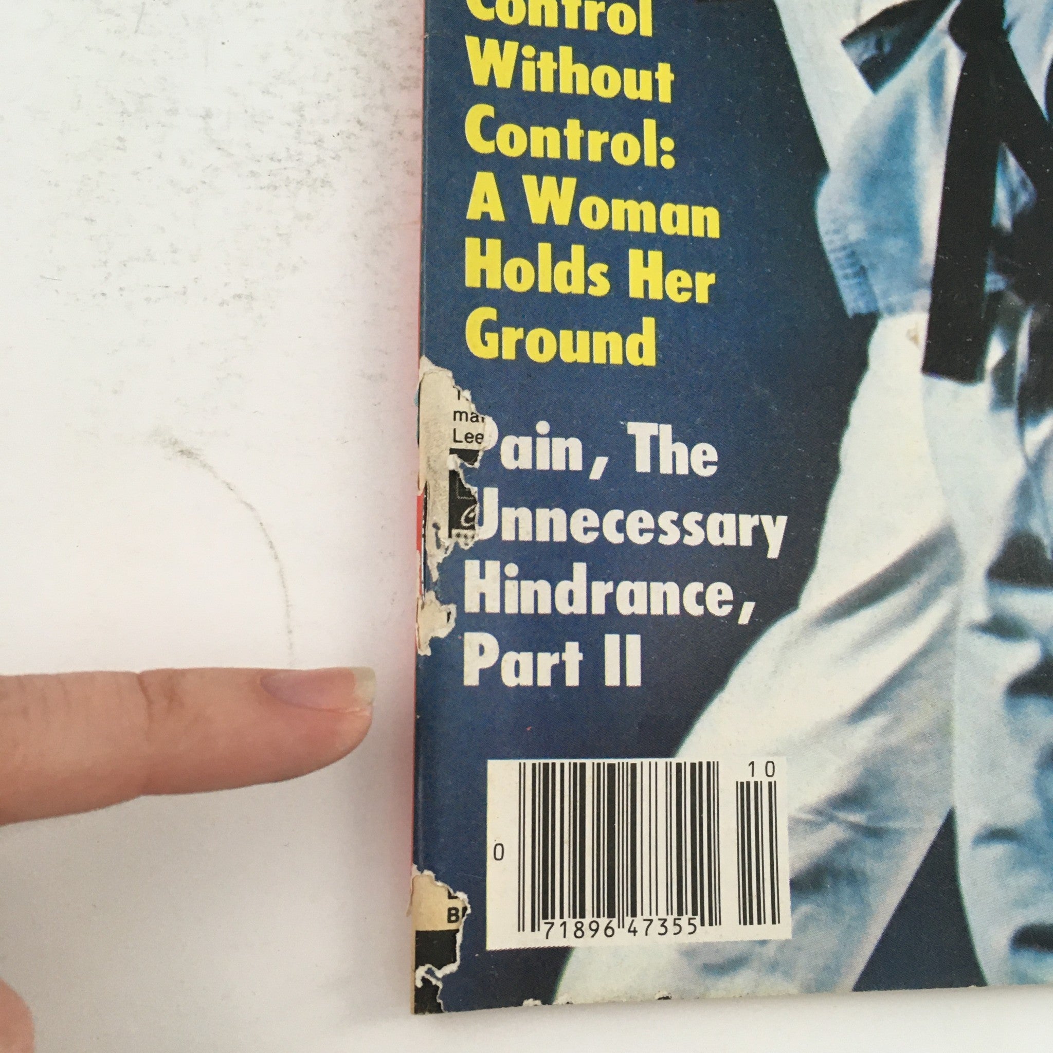 Close-up view of the spine and cover detail of Karate Illustrated Magazine October 1979 Vol 10 #10, showing wear and an address label, highlighting its vintage condition.