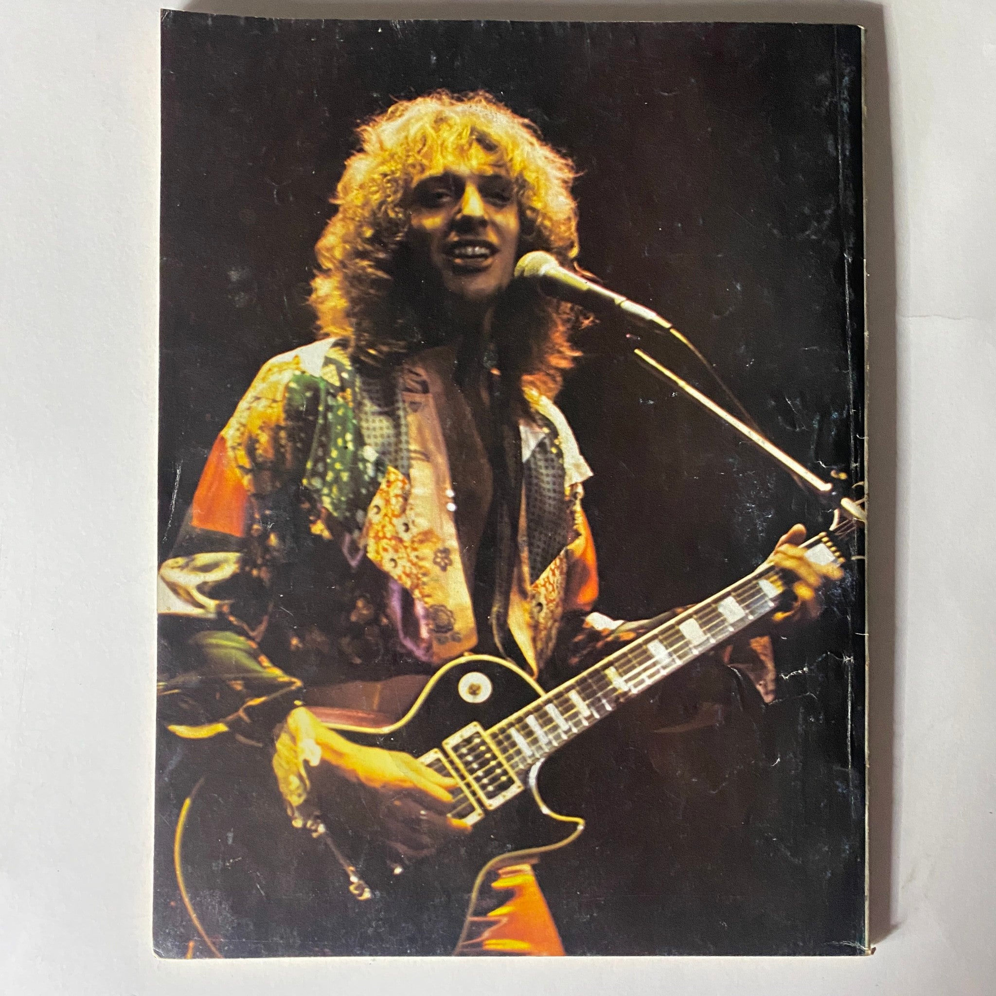 Cover of VTG Super Rock Magazine June 1977 Vol 1 No. 1 depicting a musician with long hair and a guitar, representing the vibrant 1970s rock scene.