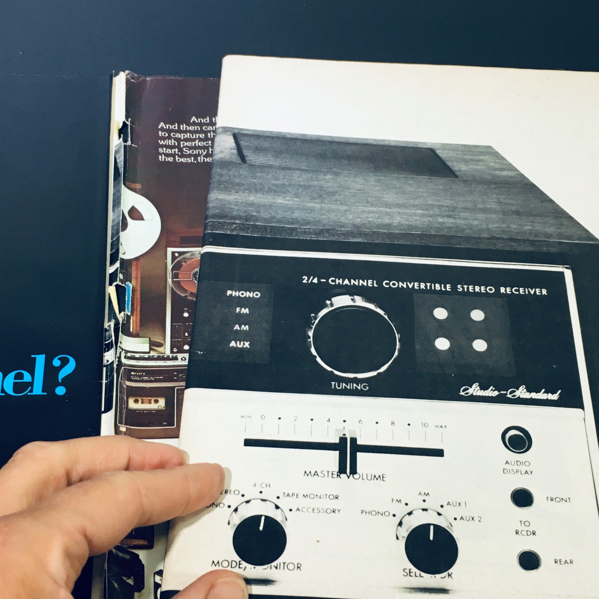 Interior page of VTG High Fidelity Magazine November 1973 showcasing a 2/4 channel convertible stereo receiver with detailed controls for audio tuning and volume.