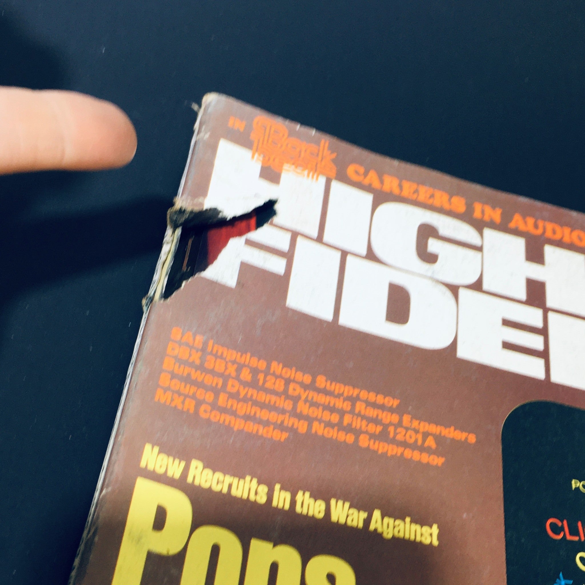 Close-up of the VTG High Fidelity Magazine July 1977, highlighting the title and some damage at the top left corner. This issue dives into audio production, making it a collectible item for enthusiasts of vintage music magazines.