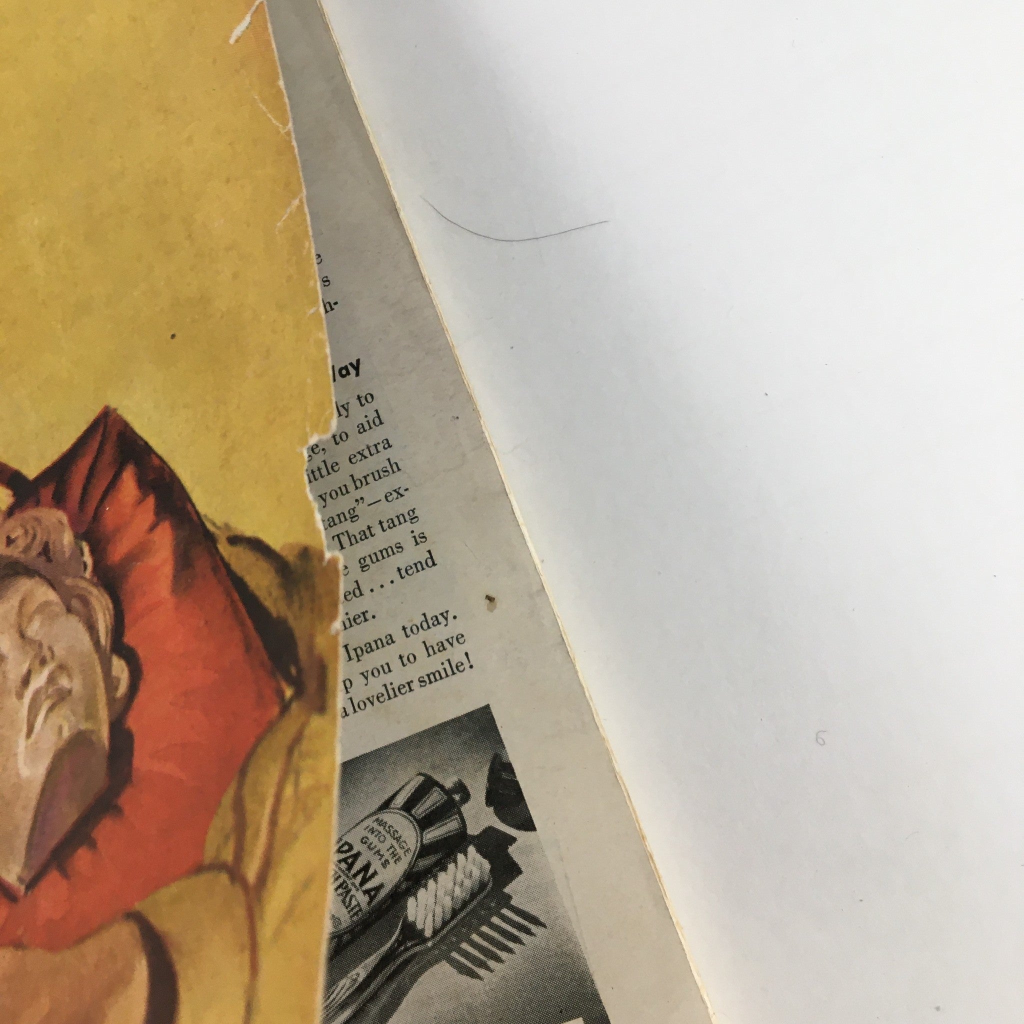 Close-up detail of the cover edge of VTG Cosmopolitan Magazine March 1940 showing wear and the magazine's title.