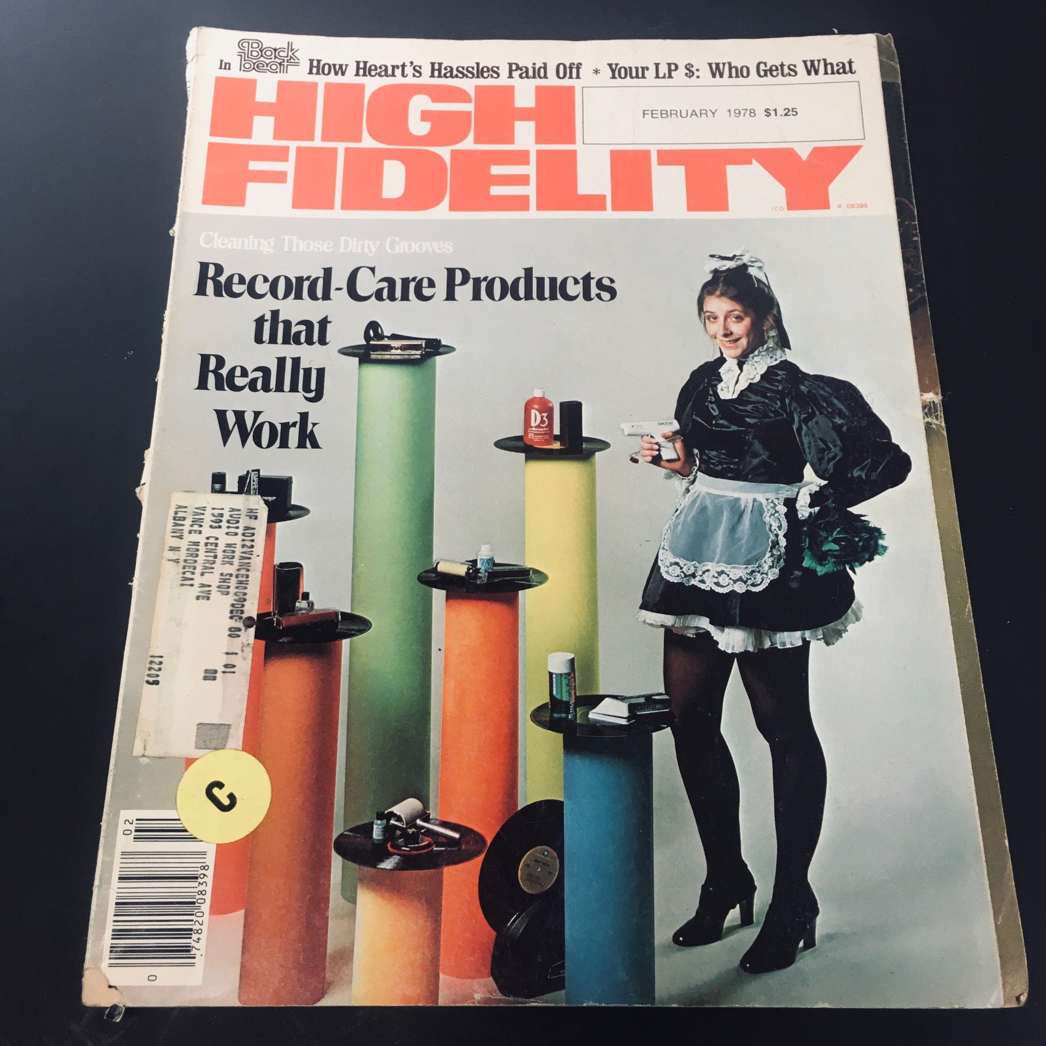 High Fidelity Magazine February 1978 cover featuring the title 'How Heart's Hassle Paid Off', showcasing a woman in vintage attire holding cleaning products with vibrant colored columns in the background.