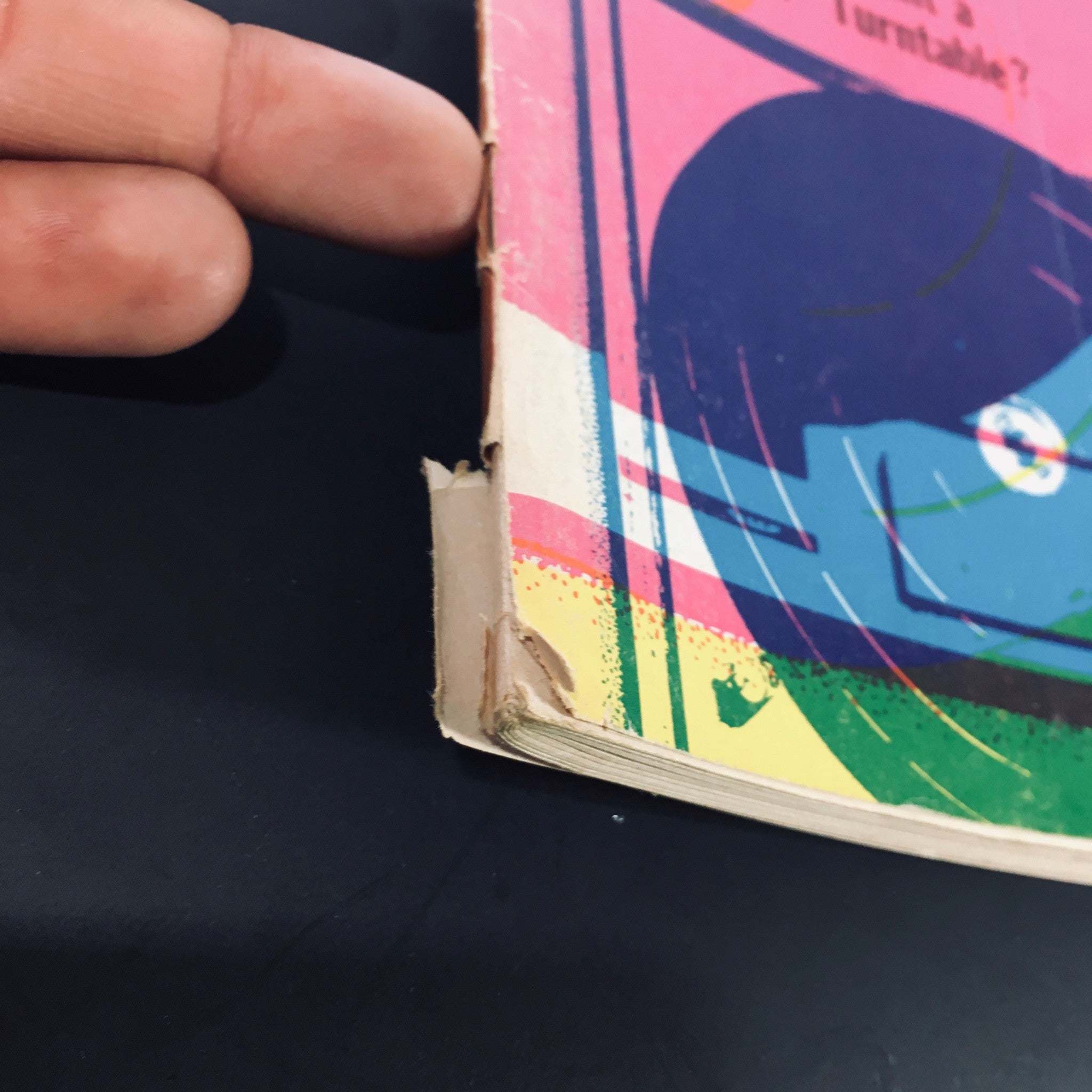 Side view of the VTG High Fidelity Magazine May 1971 - Turntables & Changers For Stereo Guide showing minor wear and loose binding typical for vintage magazines.