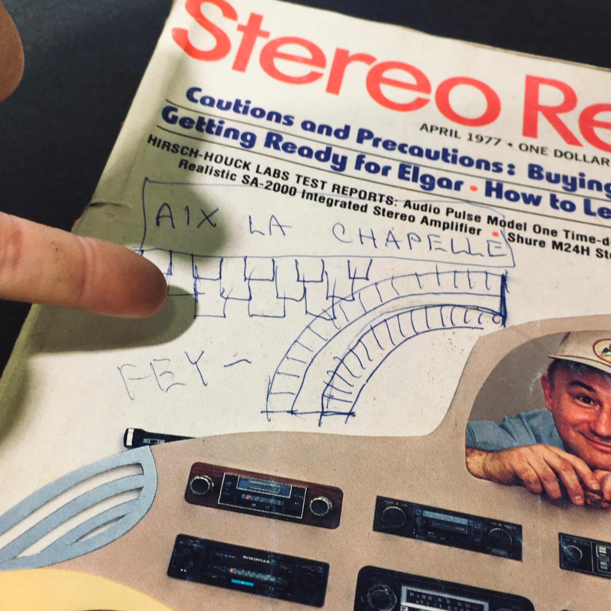 Close-up view of the VTG Stereo Review Magazine April 1977 cover, highlighting handwritten notes and the graphic design elements related to audio equipment, specifically the Shure M24H Stereo Quadraphonic Cartridge.