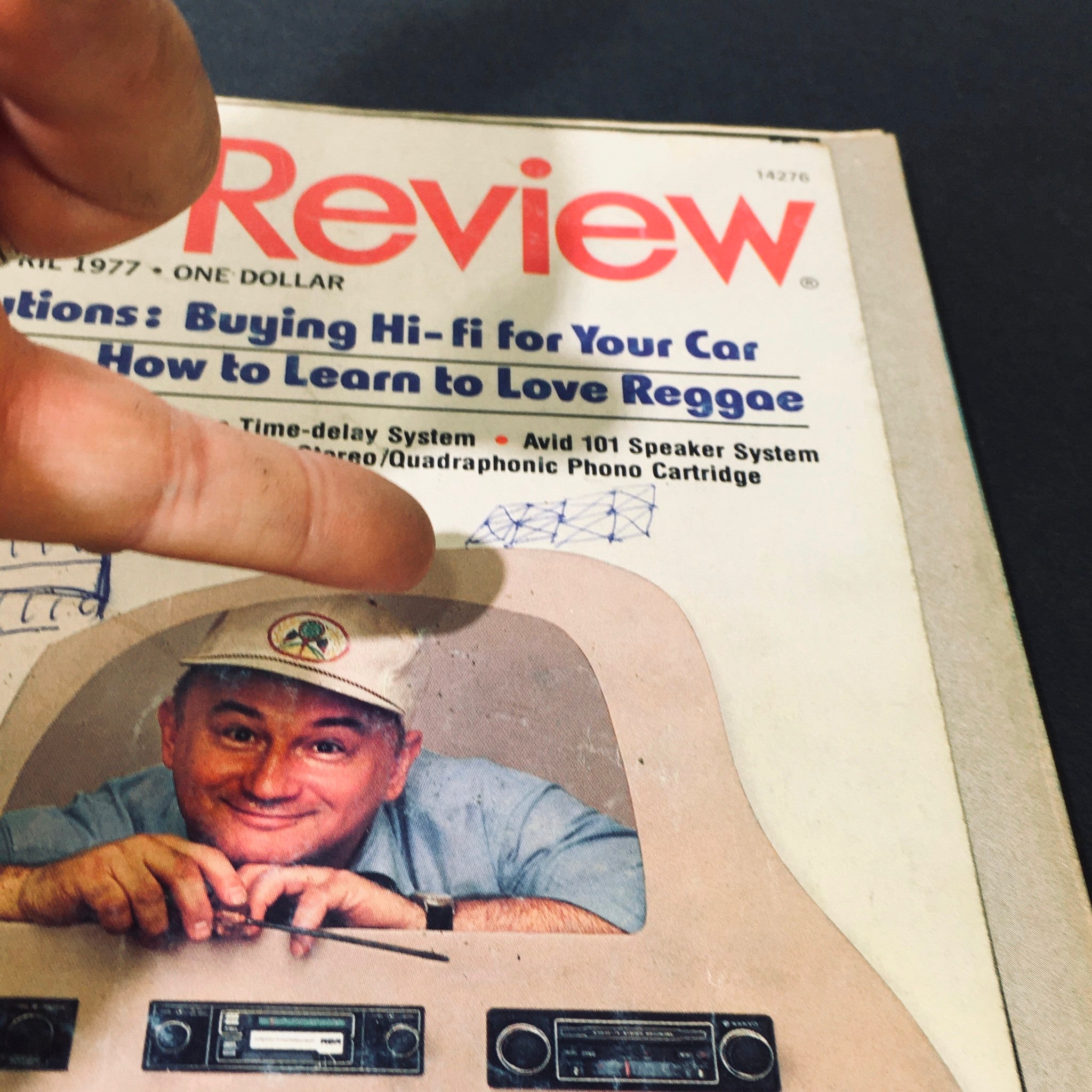 Detailed view of the VTG Stereo Review Magazine April 1977 cover with a focus on a man's smile and audio equipment graphics, emphasizing the magazine's theme around the Shure M24H Stereo Quadraphonic Cartridge.