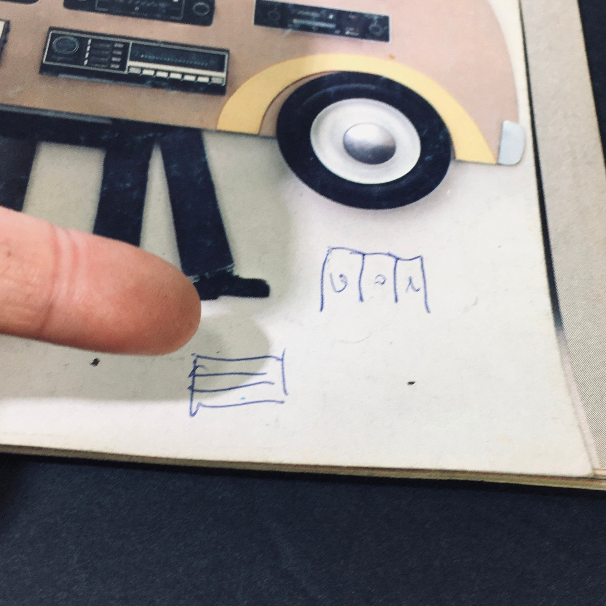 Another detail of the VTG Stereo Review Magazine April 1977 featuring a finger pointing at handwritten notes on the cover, emphasizing its authentic vintage condition and unique character.
