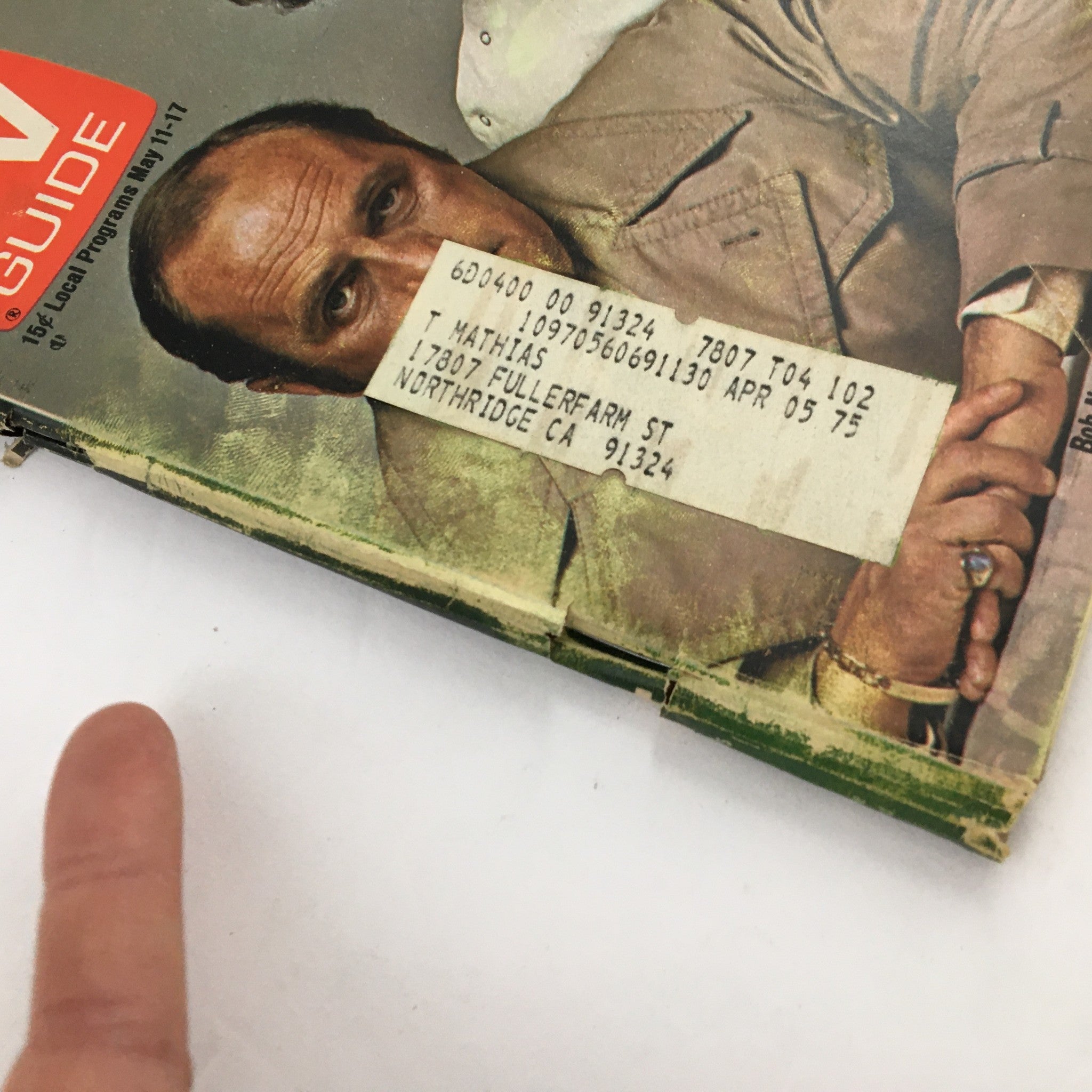 Close-up of the TV Guide Magazine May 11, 1974 cover featuring Bob Newhart and Peter Bonerz, highlighting a vintage address label on the front, adding character to this collectible.