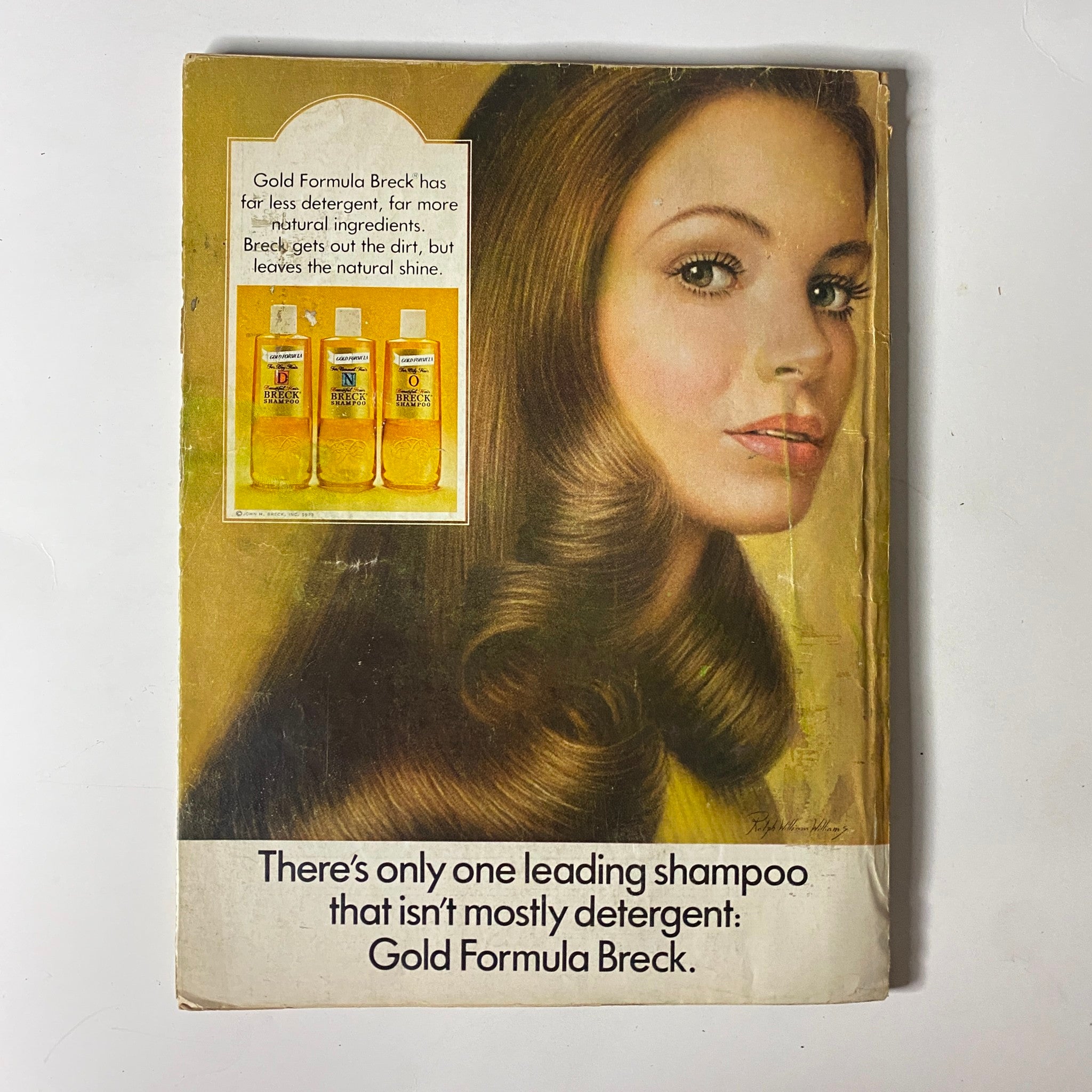 Mademoiselle Magazine February 1974 advertisement for Gold Formula Breck shampoo, featuring a woman with shiny hair, promoting the product's gentle cleansing benefits.