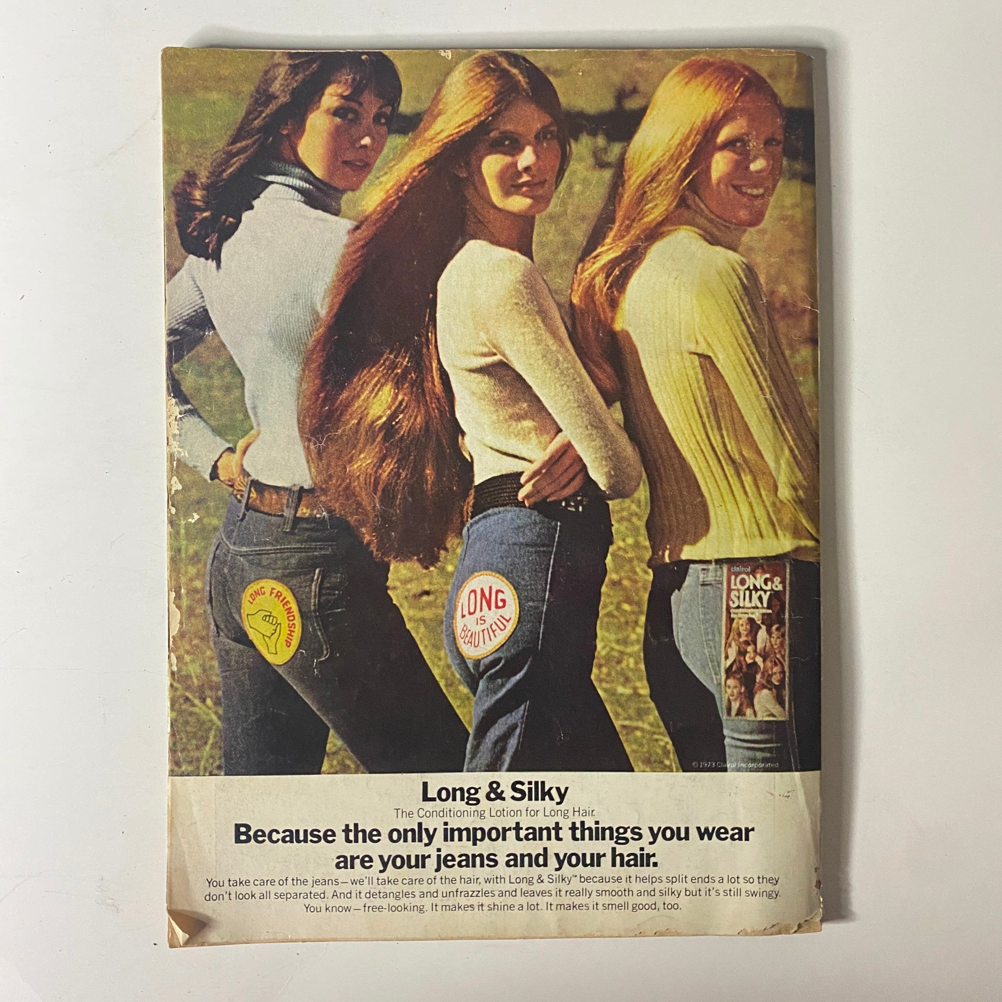 Back cover of Mademoiselle Magazine, July 1973. The advertisement features three women modeling denim, accompanied by the tagline emphasizing the importance of jeans and personal style.
