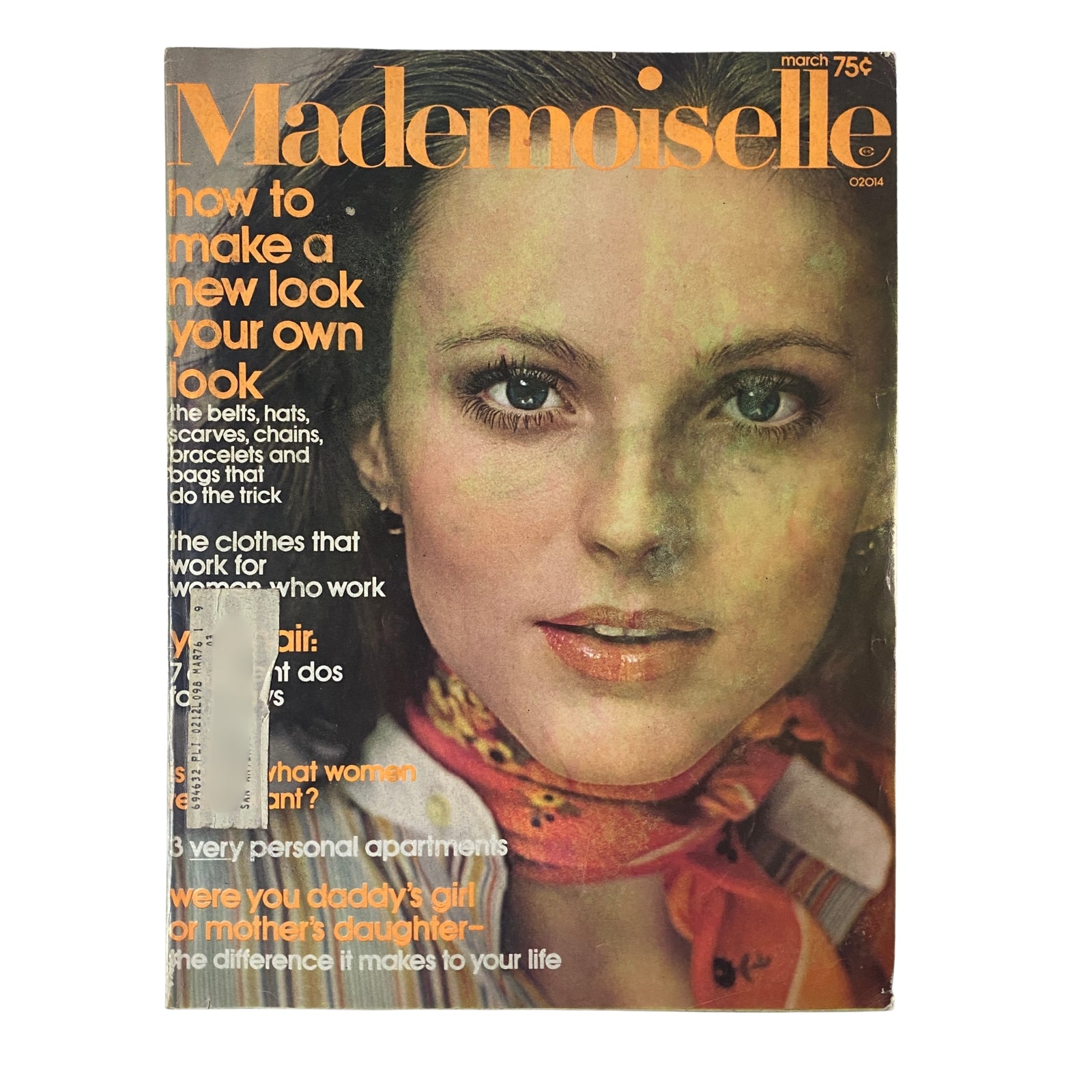 Cover of Mademoiselle Magazine March 1974 featuring a model with natural makeup and a floral scarf, accompanied by the headline 'How to Make a New Look Your Own Look'.