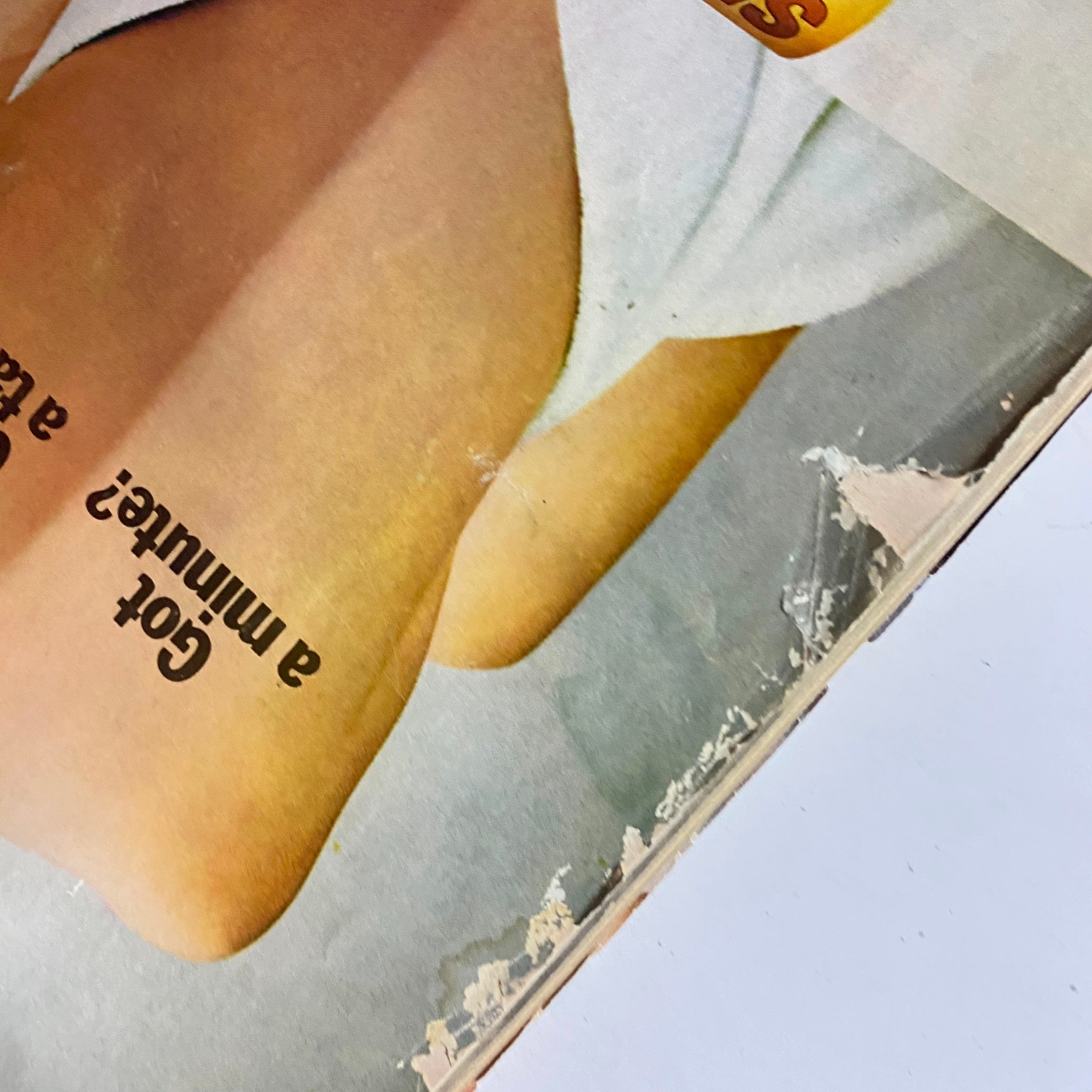 Another cover detail from Mademoiselle Magazine May 1974 displaying a close-up of tanned skin with the tagline 'Got a minute? Get a tan.' representing vintage fashion trends.