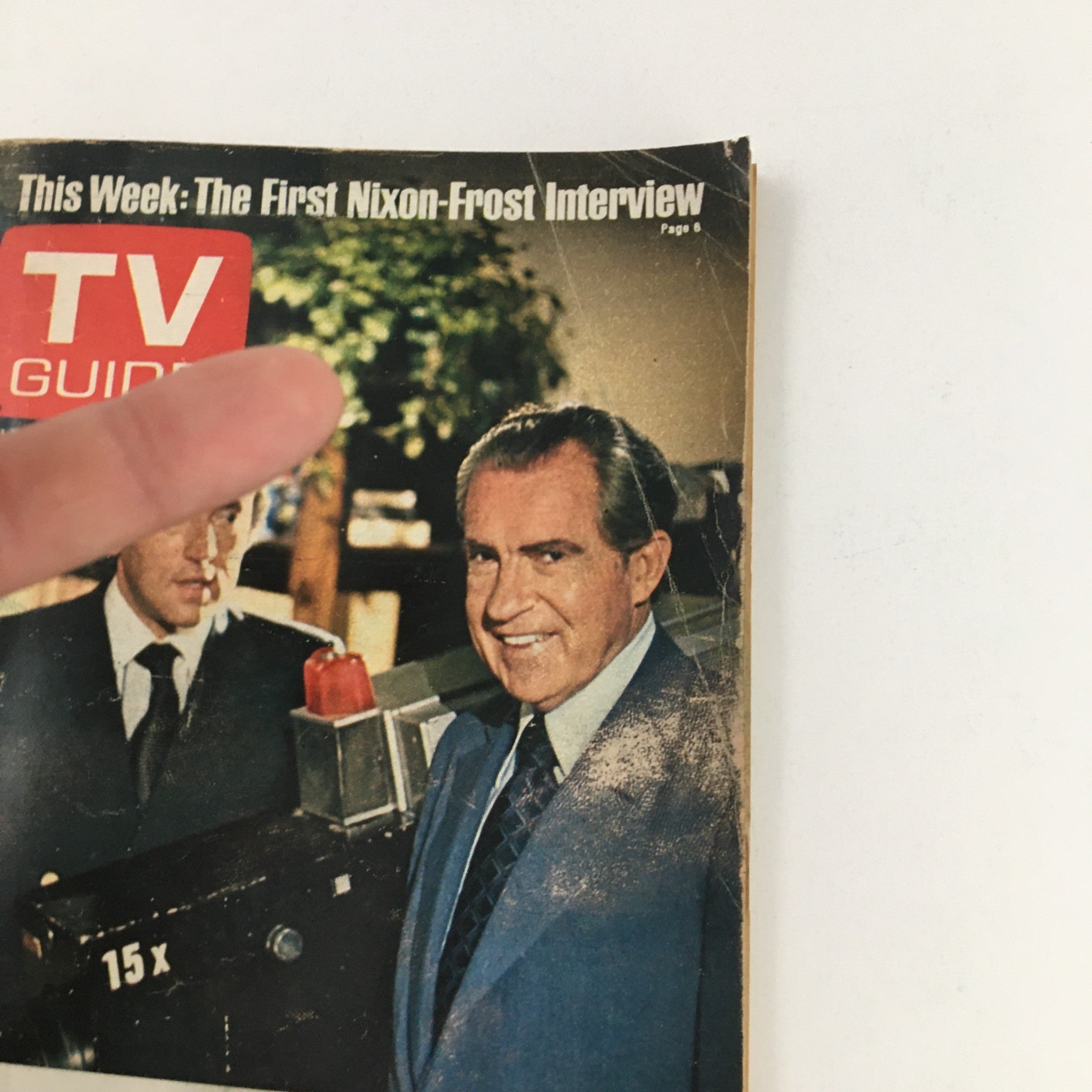 Close-up of the TV Guide Magazine cover dated April 30, 1977, showcasing Richard Nixon and David Frost, with an emphasis on the headline about the first Nixon-Frost interview.