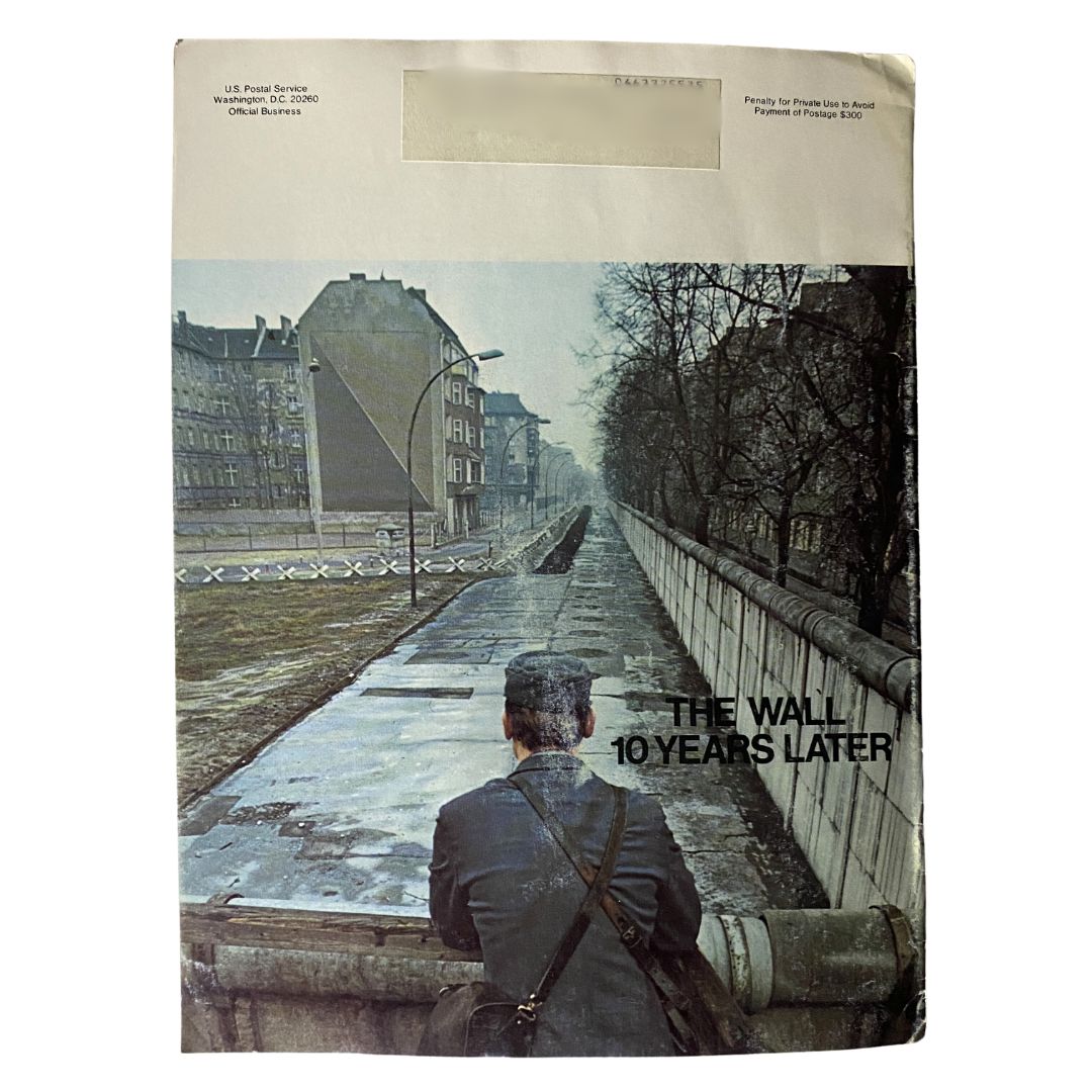 Back cover of VTG Postal Life Magazine January - February 1971, featuring a somber illustration of the Berlin Wall and a man reflecting on its significance. The cover text reads 'The Wall: 10 Years Later', encapsulating the magazine's exploration of the socio-political climate in Berlin during the Cold War.