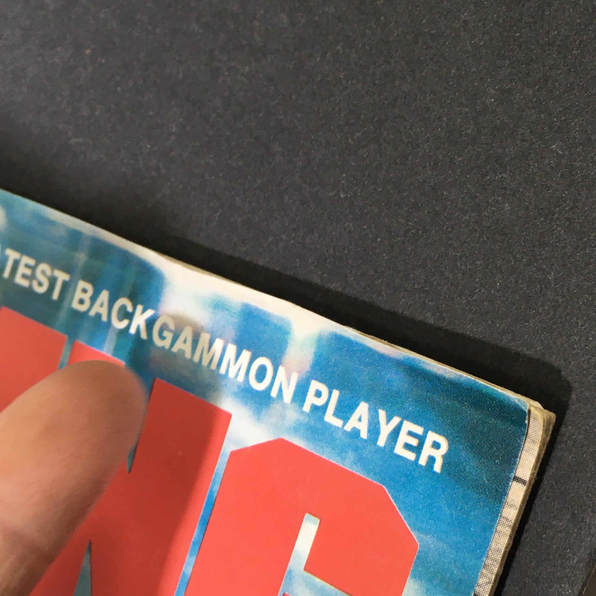Close-up of the spine of VTG Winning Magazine January 1977 showing the title and details related to backgammon.