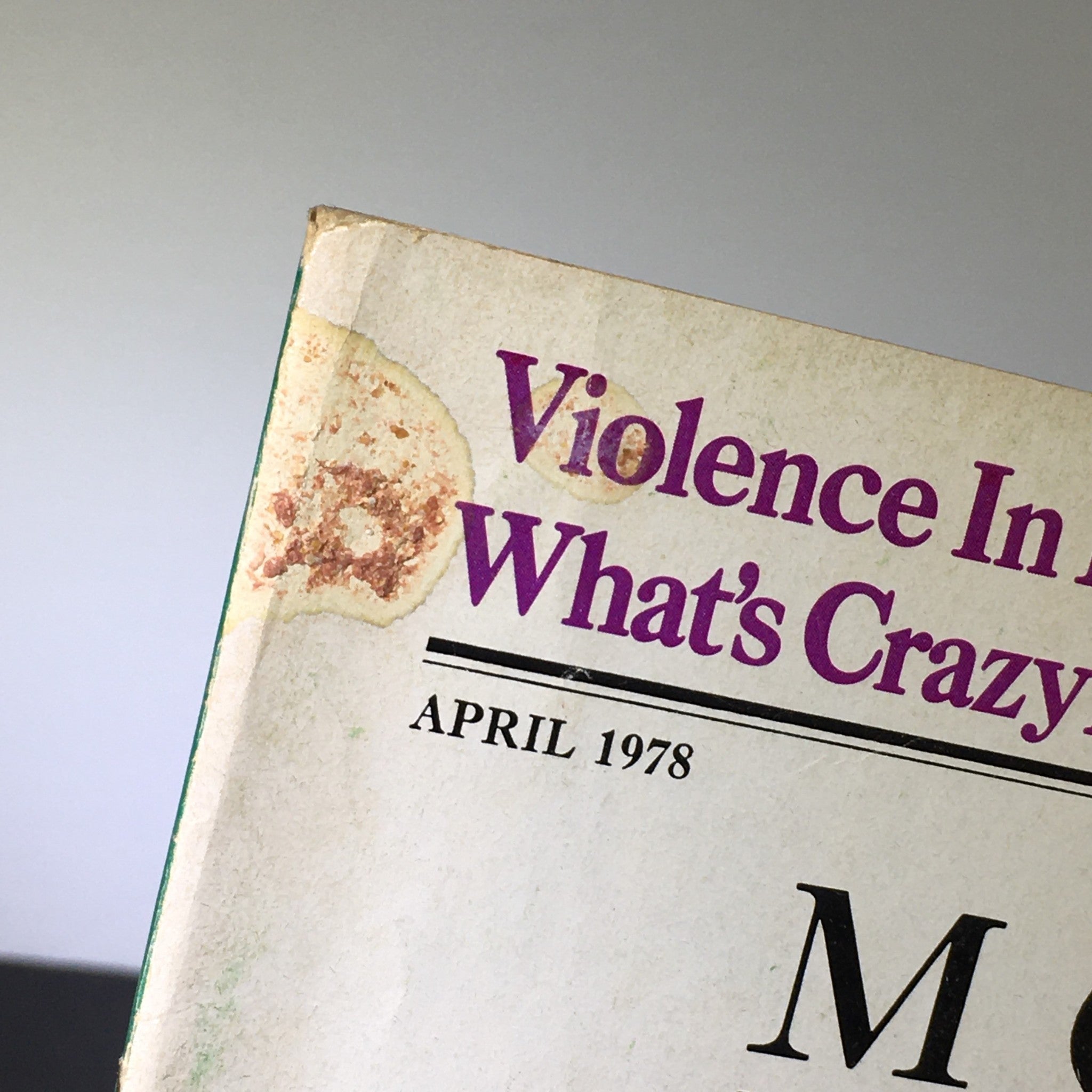 Close-up of the cover of Mother Jones Magazine from April 1978 featuring the article 'Violence In America: What's Crazy?' and indicating vintage condition.