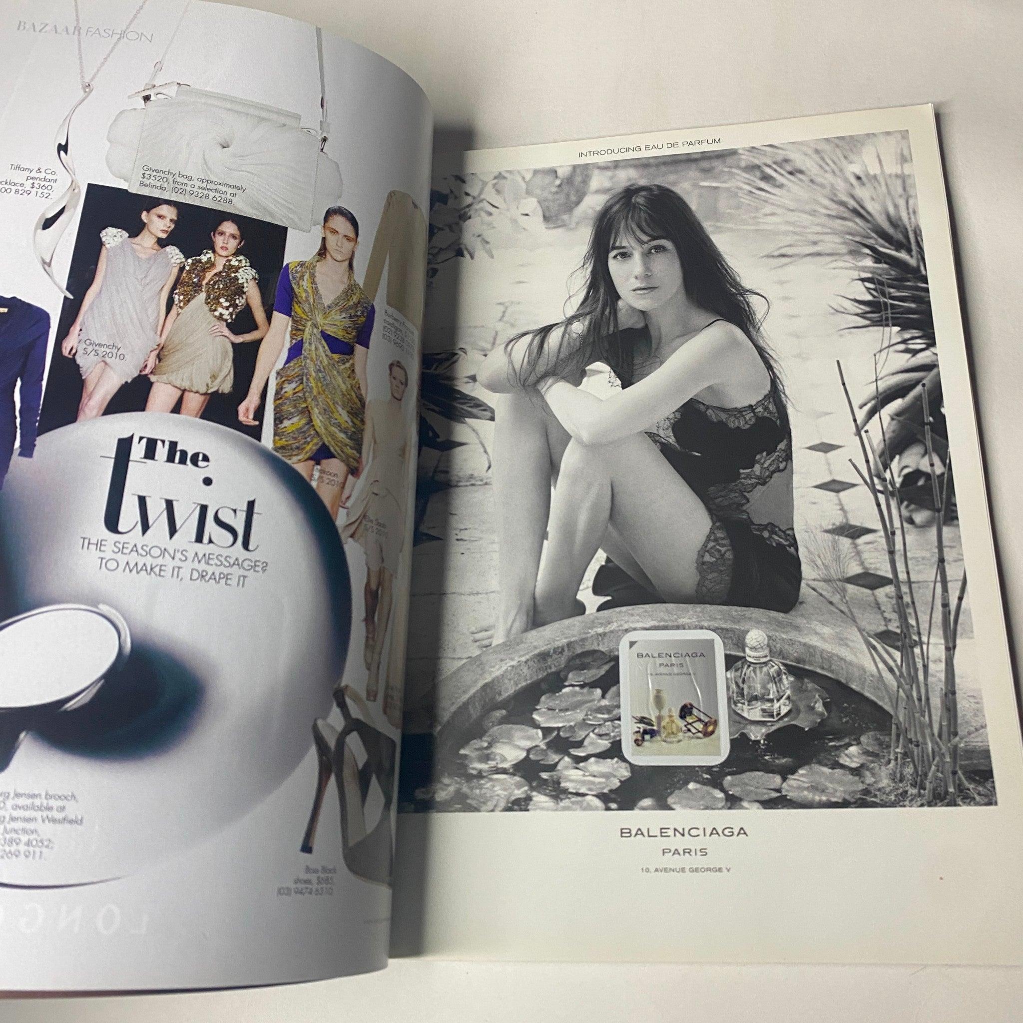 An advertisement spread from Harper's Bazaar Australia Magazine May 2010 showcasing Balenciaga fashion with a model in a serene setting.
