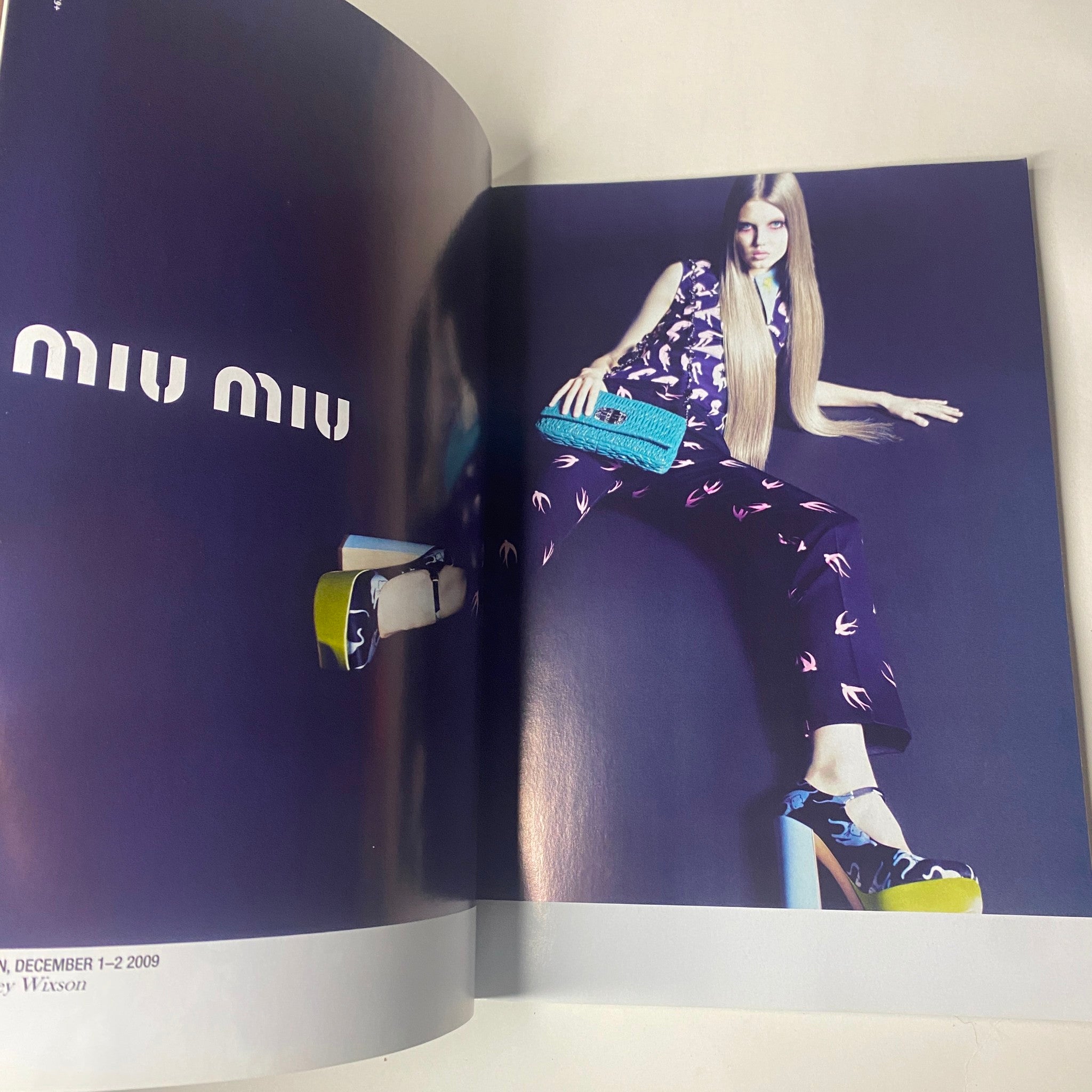 A fashion editorial spread from Harper's Bazaar Australia Magazine May 2010 featuring a model in Miu Miu clothing against a vibrant backdrop.