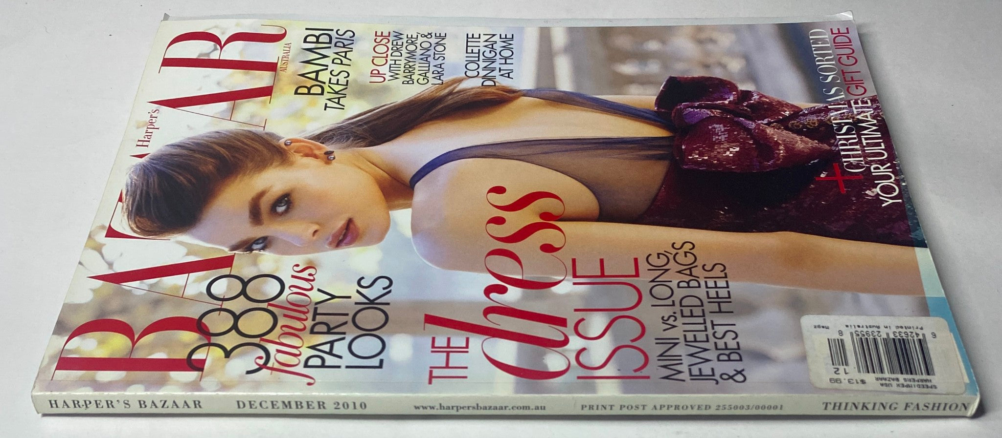 Harper's Bazaar Australia December 2010 magazine cover featuring Bambi Northwood-Blyth, showcasing the theme 'The Dress Issue' and party looks.