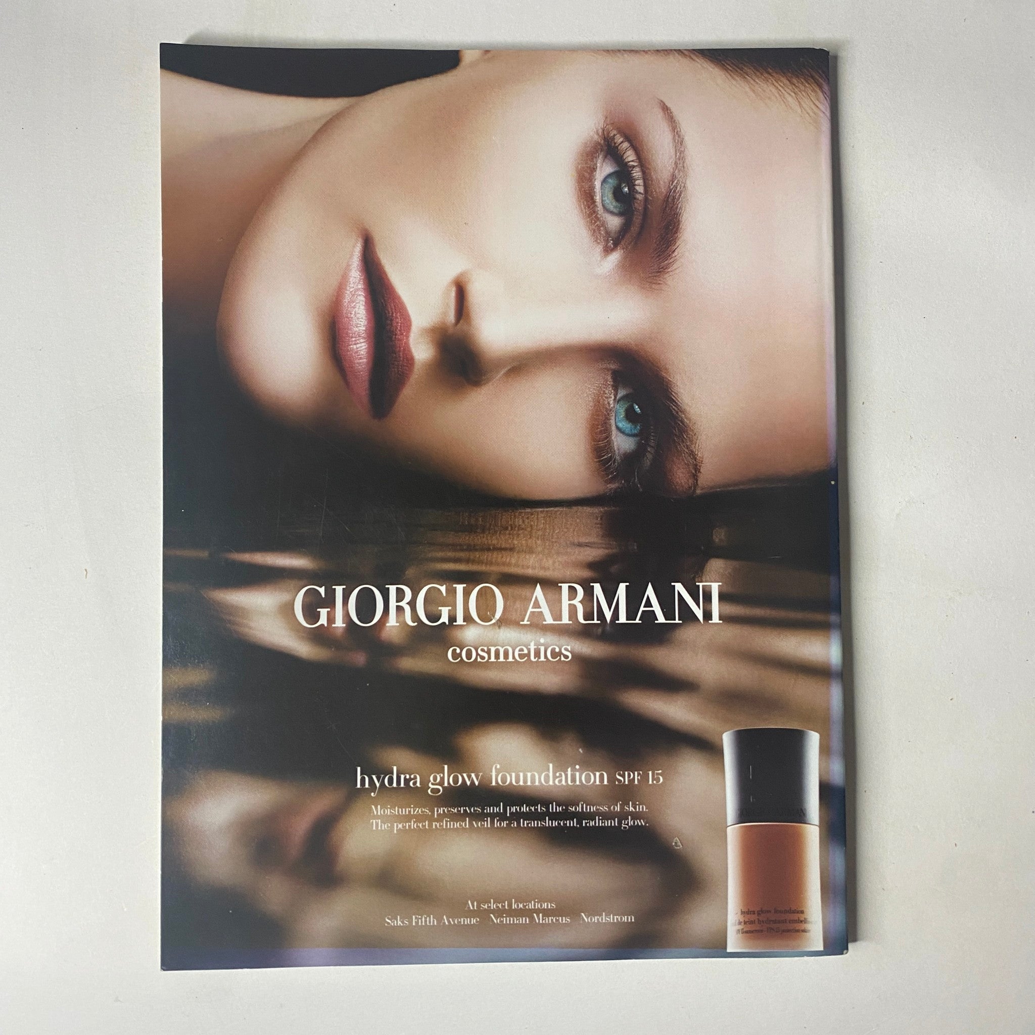 Harper's Bazaar Magazine April 2005 cosmetics advertisement for Giorgio Armani's Hydra Glow Foundation, featuring a model with flawless skin.