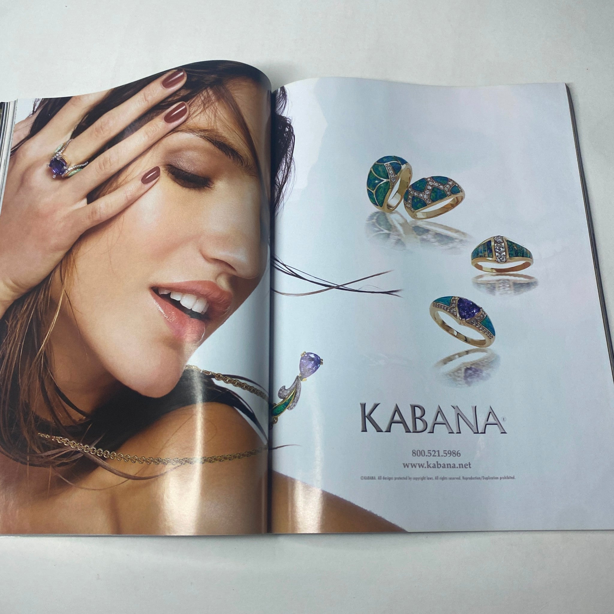 Harper's Bazaar Magazine October 2005 featuring a stunning jewelry advertisement by Kabana, showcasing elegant rings and a model with stylish nail art.