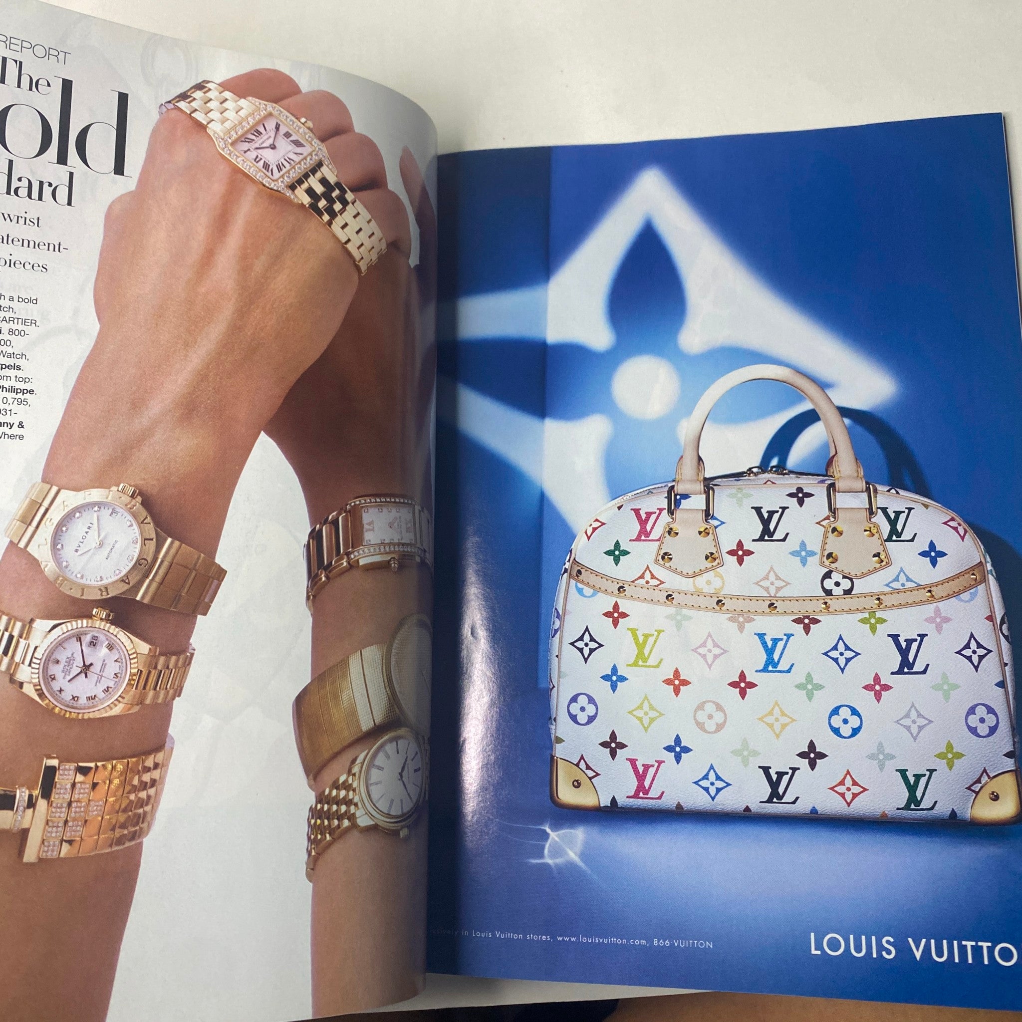 Louis Vuitton luxury handbag and elegant watches showcased in a sophisticated advertisement, featured in Harper's Bazaar Magazine January 2005 Scarlett Johansson Cover.