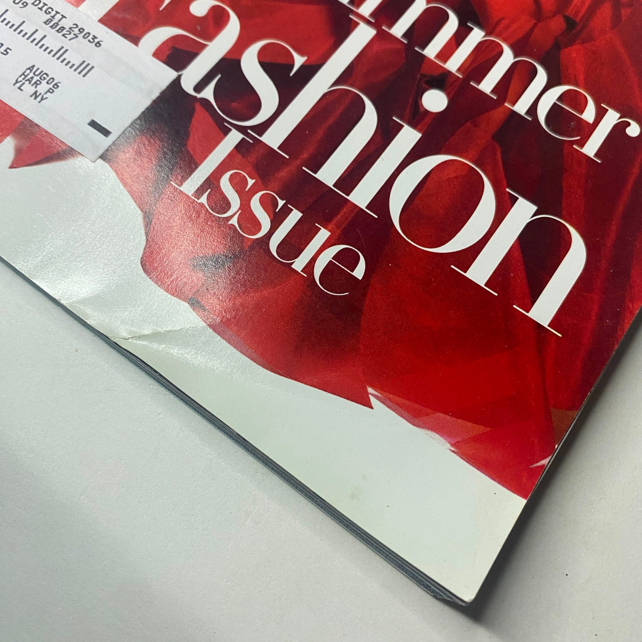 Close-up view of the Harper's Bazaar May 2006 magazine cover featuring Jennifer Lopez, highlighting the Summer Fashion Issue text with delicate red detailing.