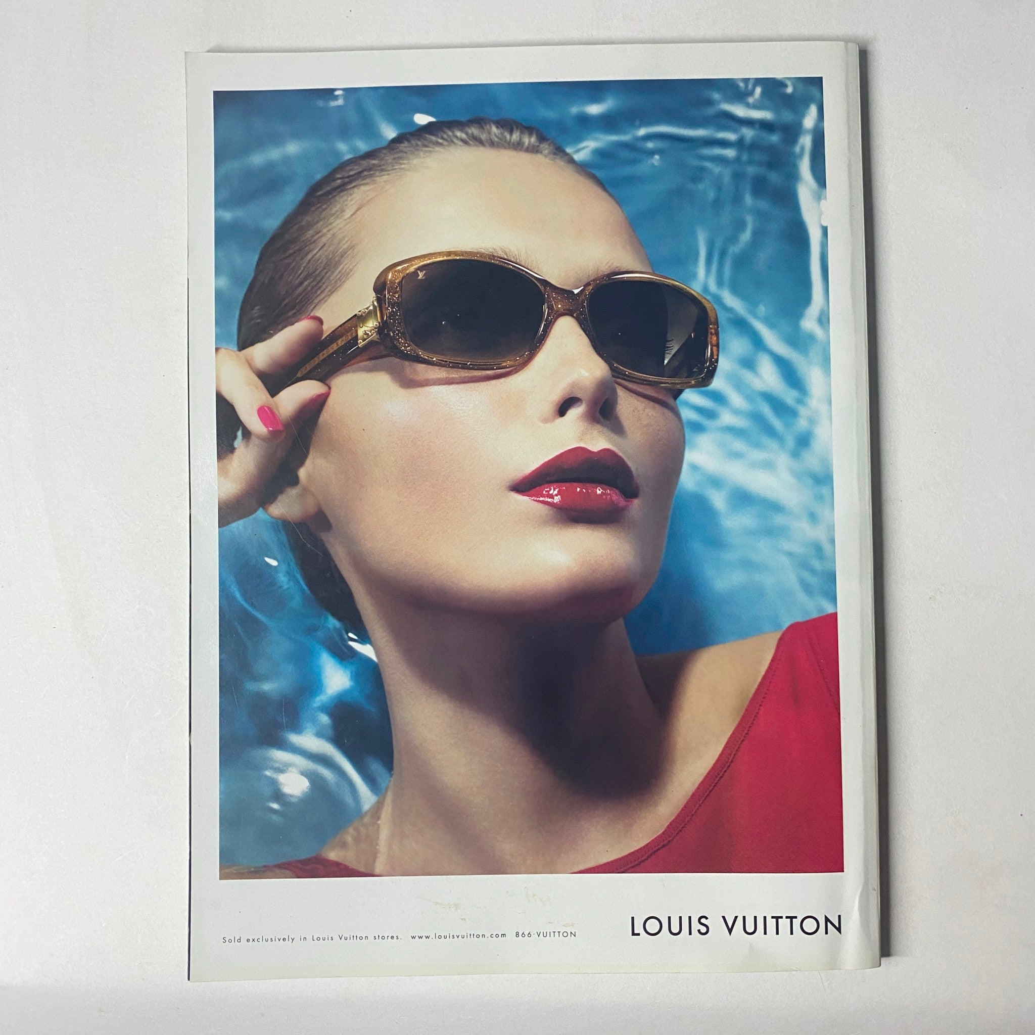 Harper's Bazaar Magazine May 2006, displaying a Louis Vuitton advertisement featuring a model with fashionable eyewear, set against a vibrant background.