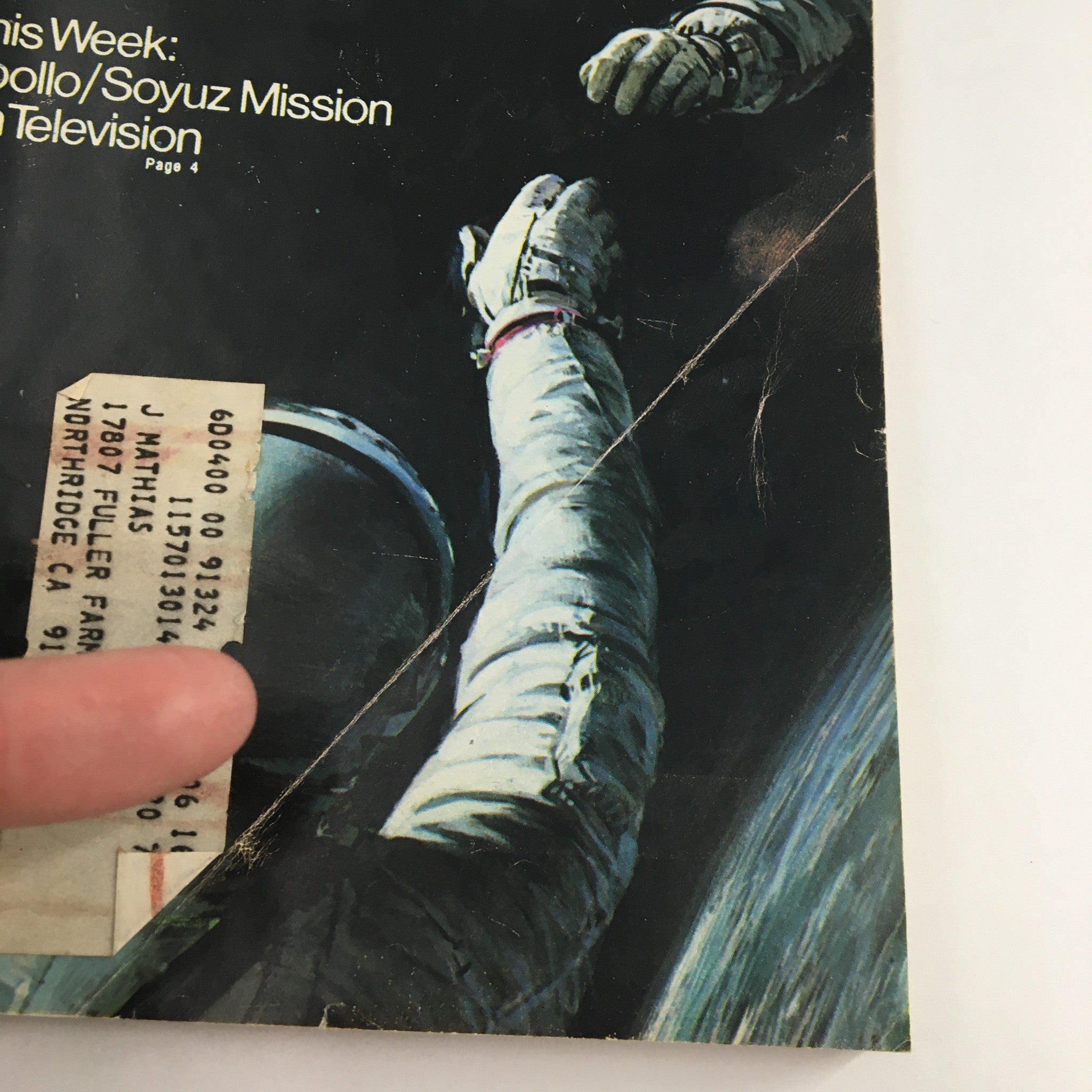Cover of TV Guide Magazine July 12 1975 showcasing the Apollo & Soyuz Mission on Television, featuring a close-up of an astronaut's hands and a visible address label on the cover.