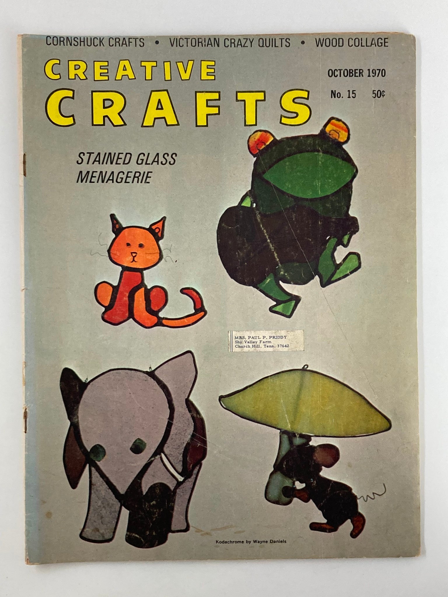 Cover of VTG Creative Crafts Magazine, October 1970 featuring the theme 'Stained Glass Menagerie' with illustrations of animals including a cat, frog, elephant, and mouse under a green umbrella.
