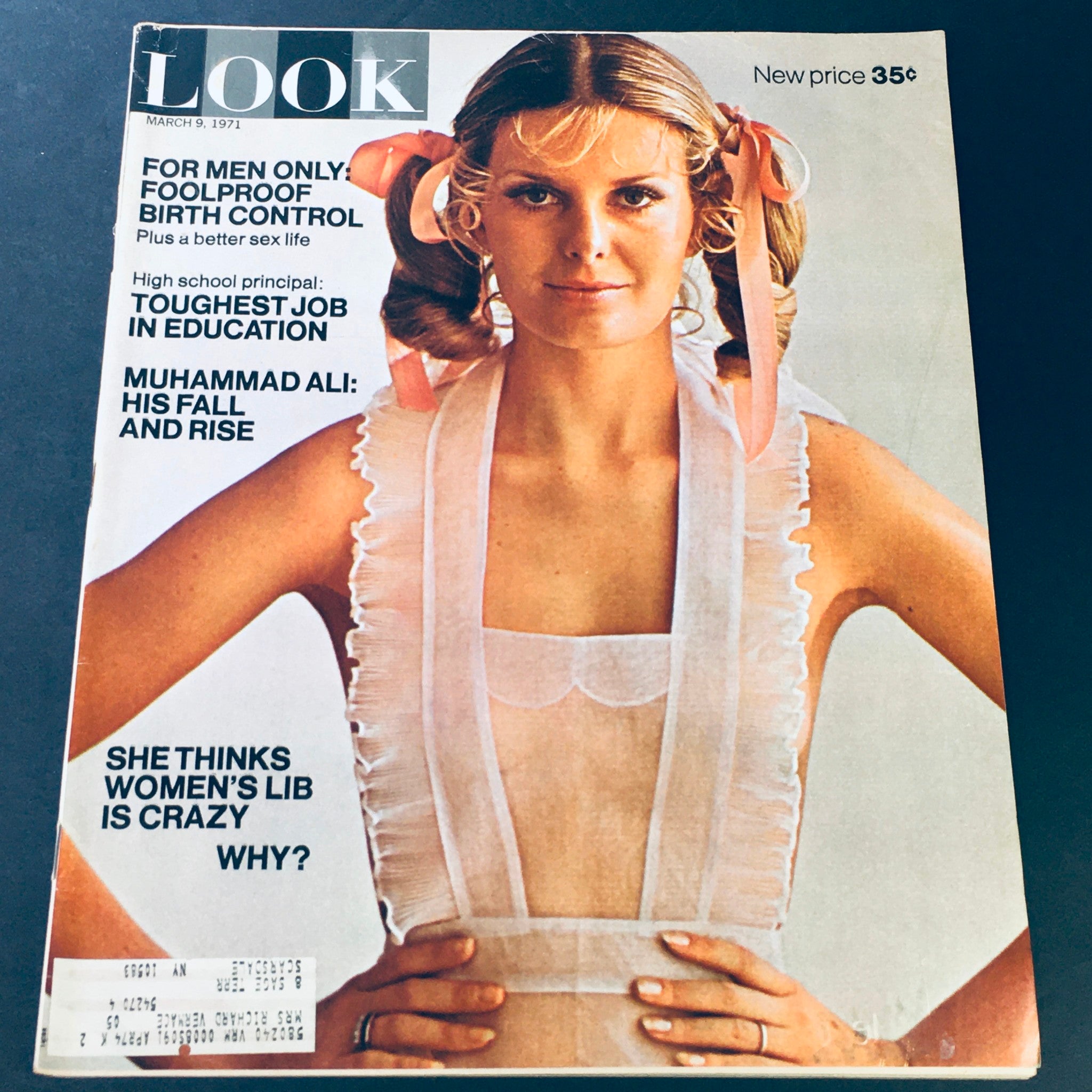 Cover of VTG Look Magazine March 9, 1971 showcasing a model with ribbons in her hair, featuring topics on birth control and women's liberation.