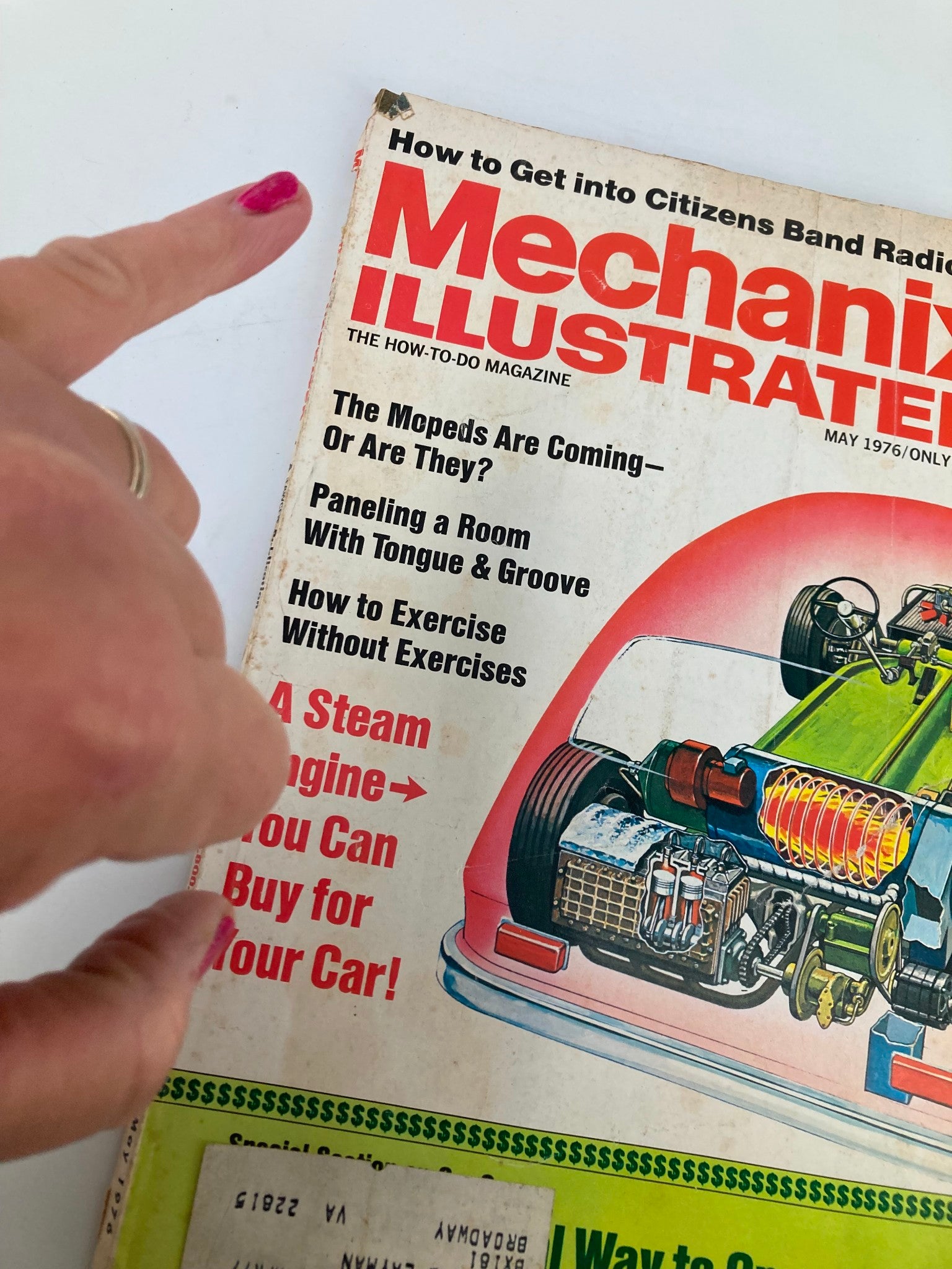 Close-up view of the front cover of VTG Mechanix Illustrated Magazine May 1976, highlighting the section about steam engines for cars.