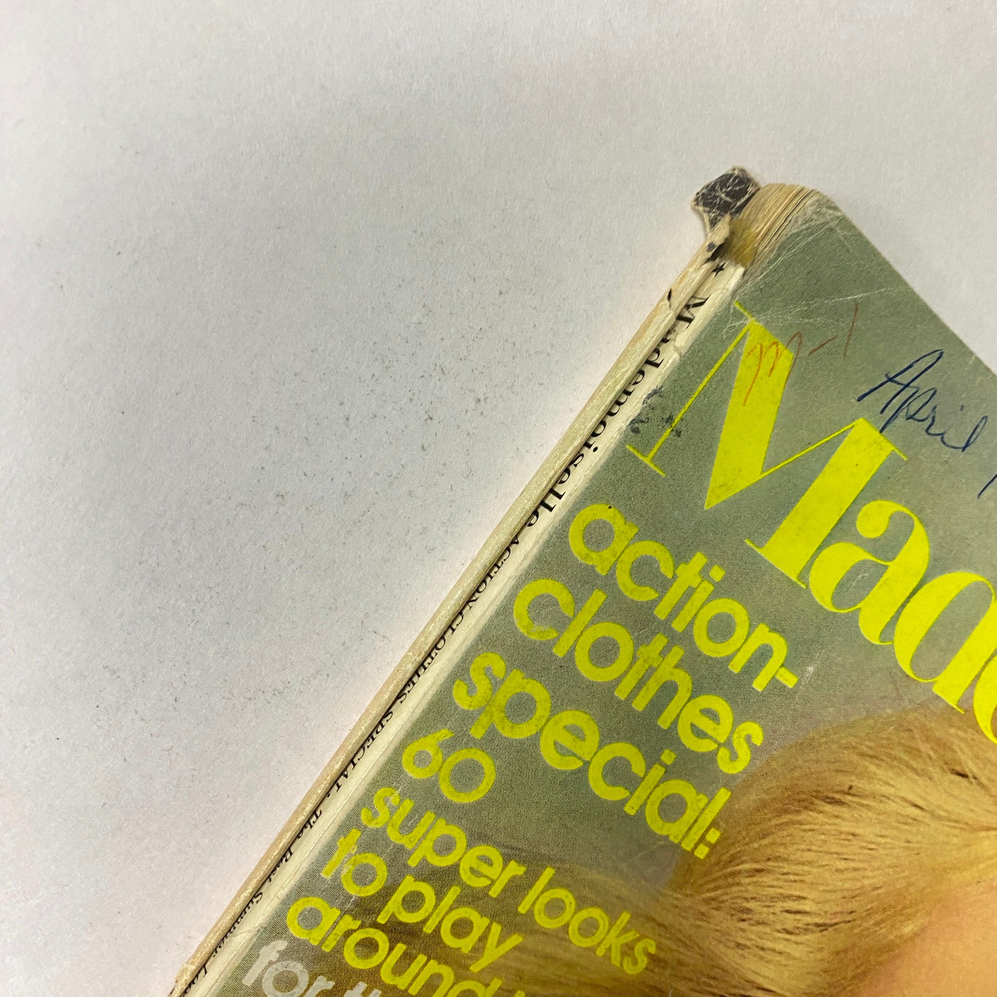 Close-up view of the top edge of Mademoiselle Magazine April 1973, revealing the title and date, with visible wear on the spine.