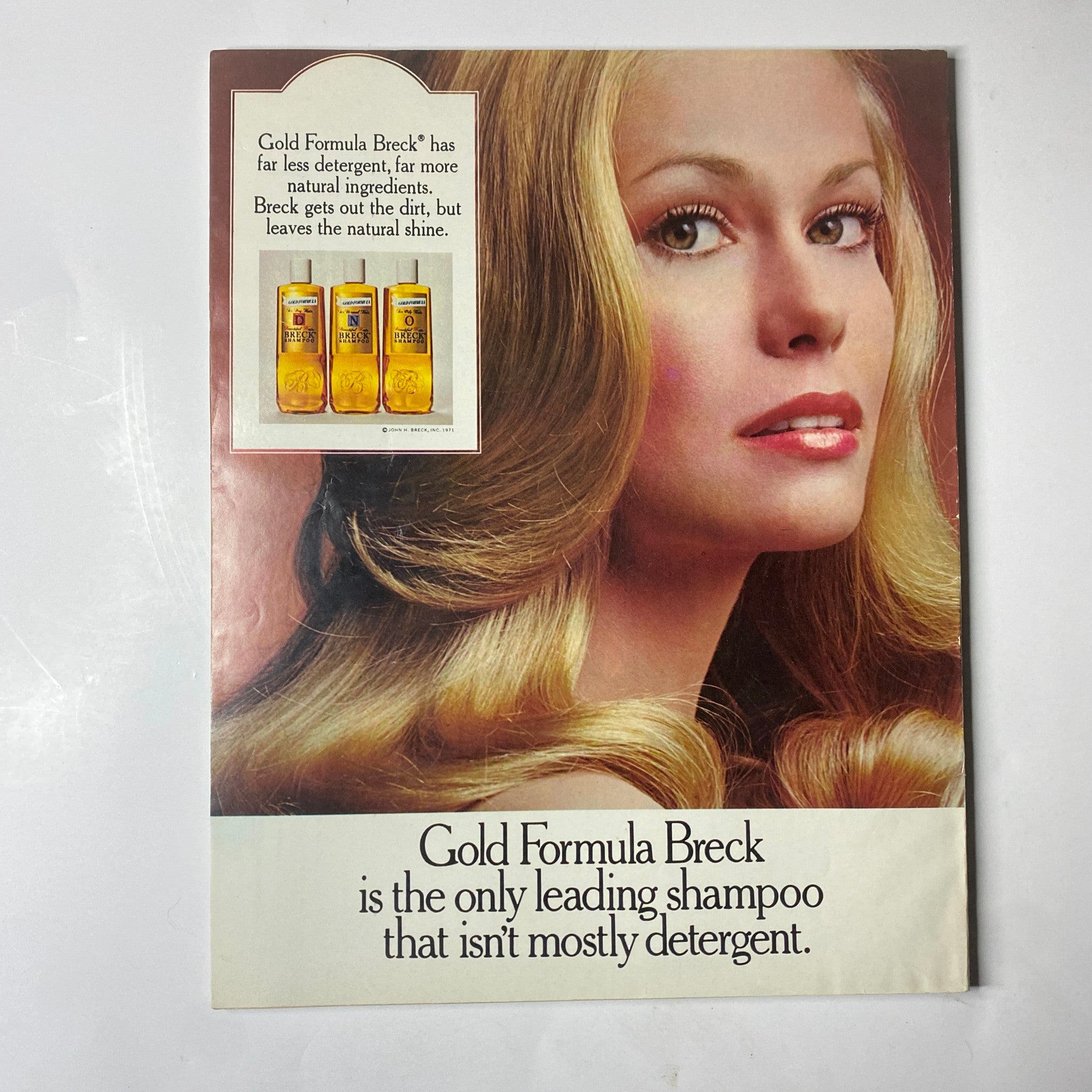 Seventeen Magazine March 1972 advertisement for Gold Formula Breck shampoo, displaying a model with glossy hair, emphasizing the product's natural shine.