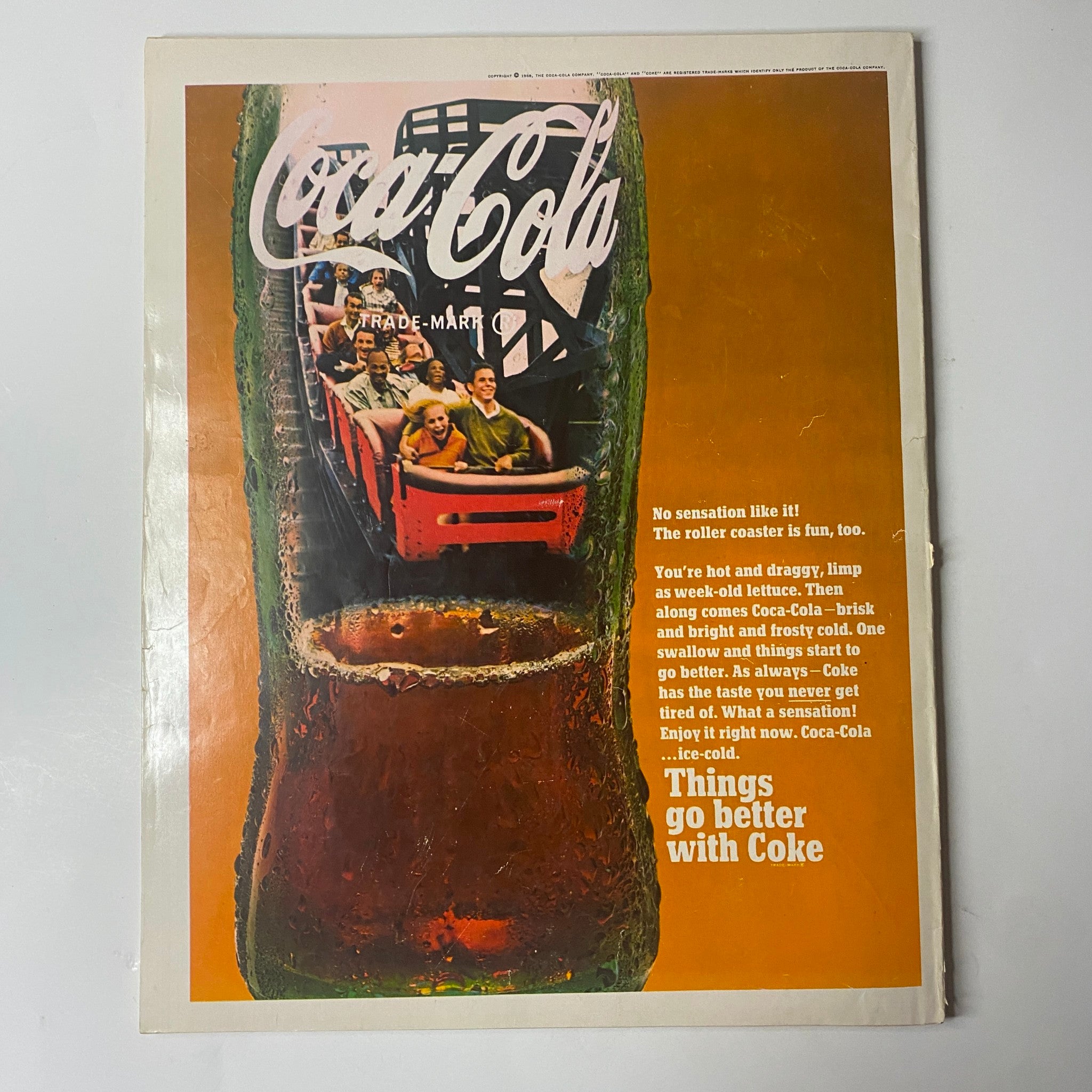 Seventeen Magazine October 1968 cover featuring Coca-Cola advertisement, with a vibrant image of a soda glass and roller coaster riders, promoting the theme 'Things Go Better with Coke'.