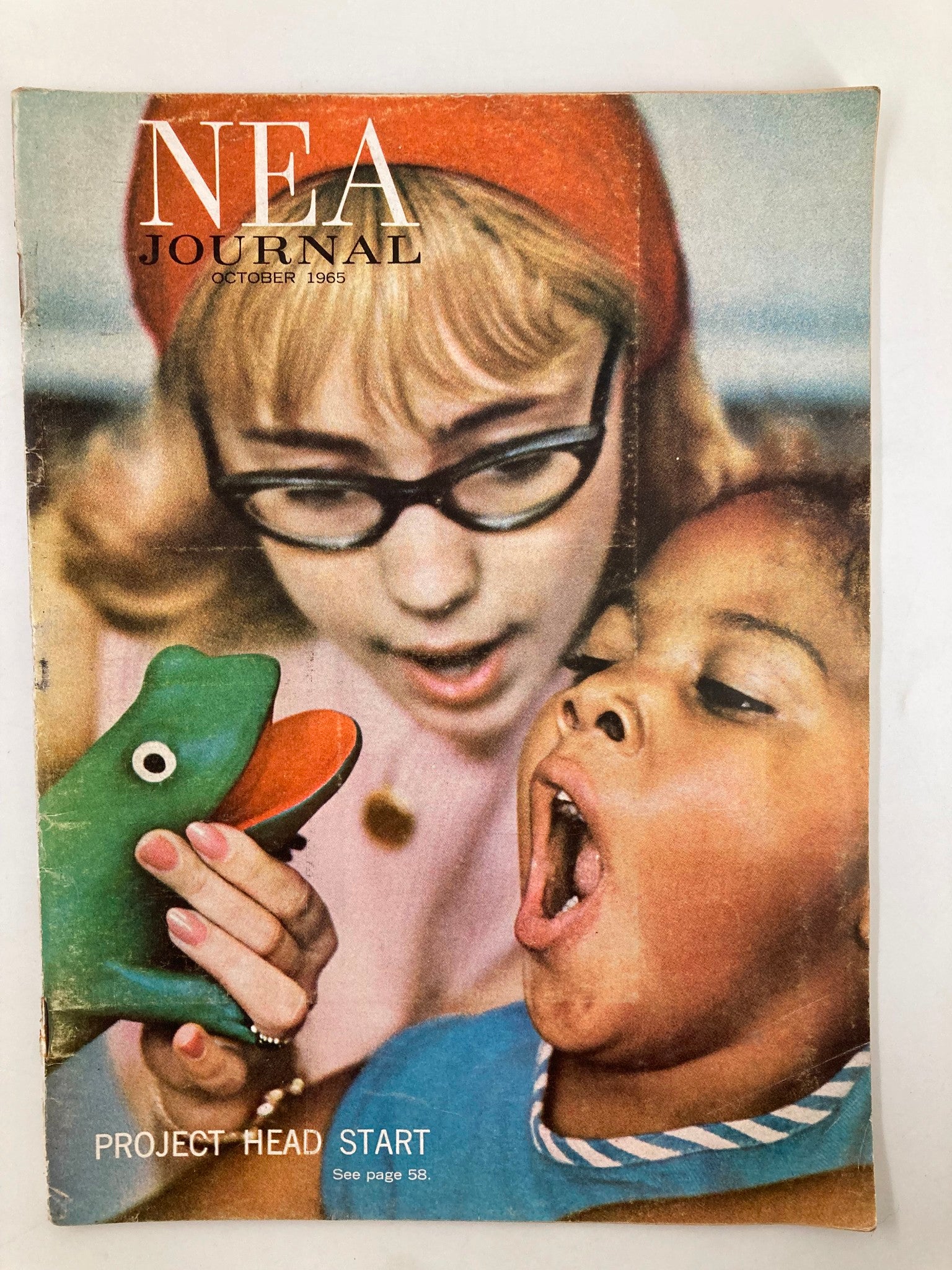 Cover of VTG NEA Journal Magazine October 1965 featuring a woman with glasses and a child engaging with a toy while discussing educational themes.