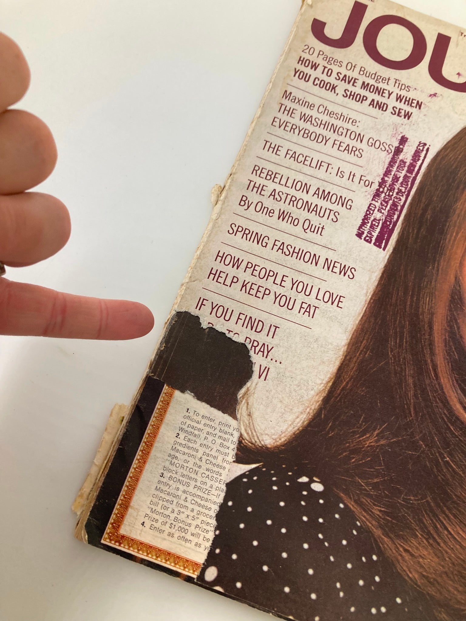 Close-up view of the March 1970 Ladies' Home Journal magazine featuring the title 'Rebellion Among The Astronauts' with visible wear on the binding and cover.