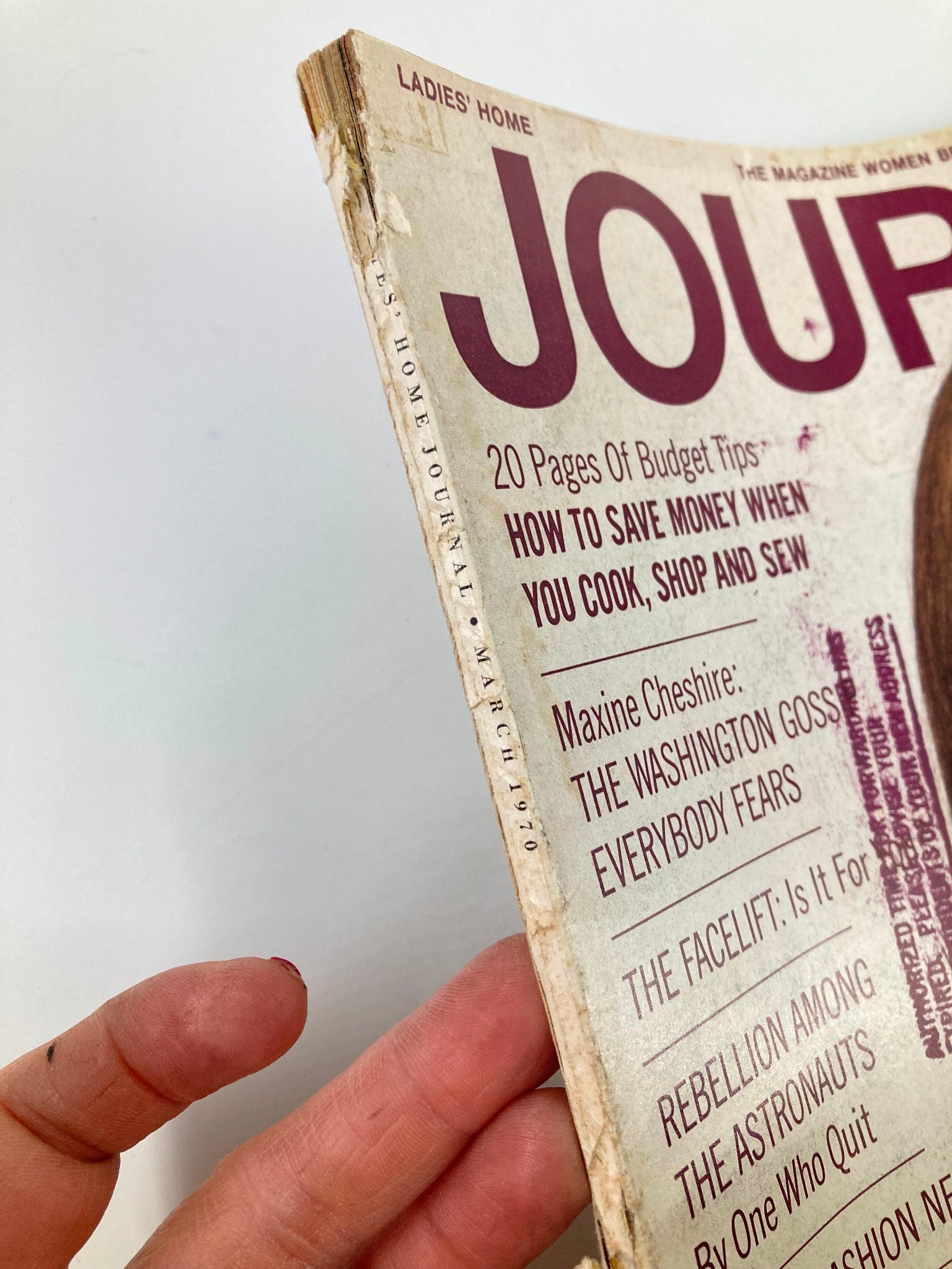 Side view of the March 1970 Ladies' Home Journal magazine showcasing its worn edges and the title 'Rebellion Among The Astronauts' prominently displayed.