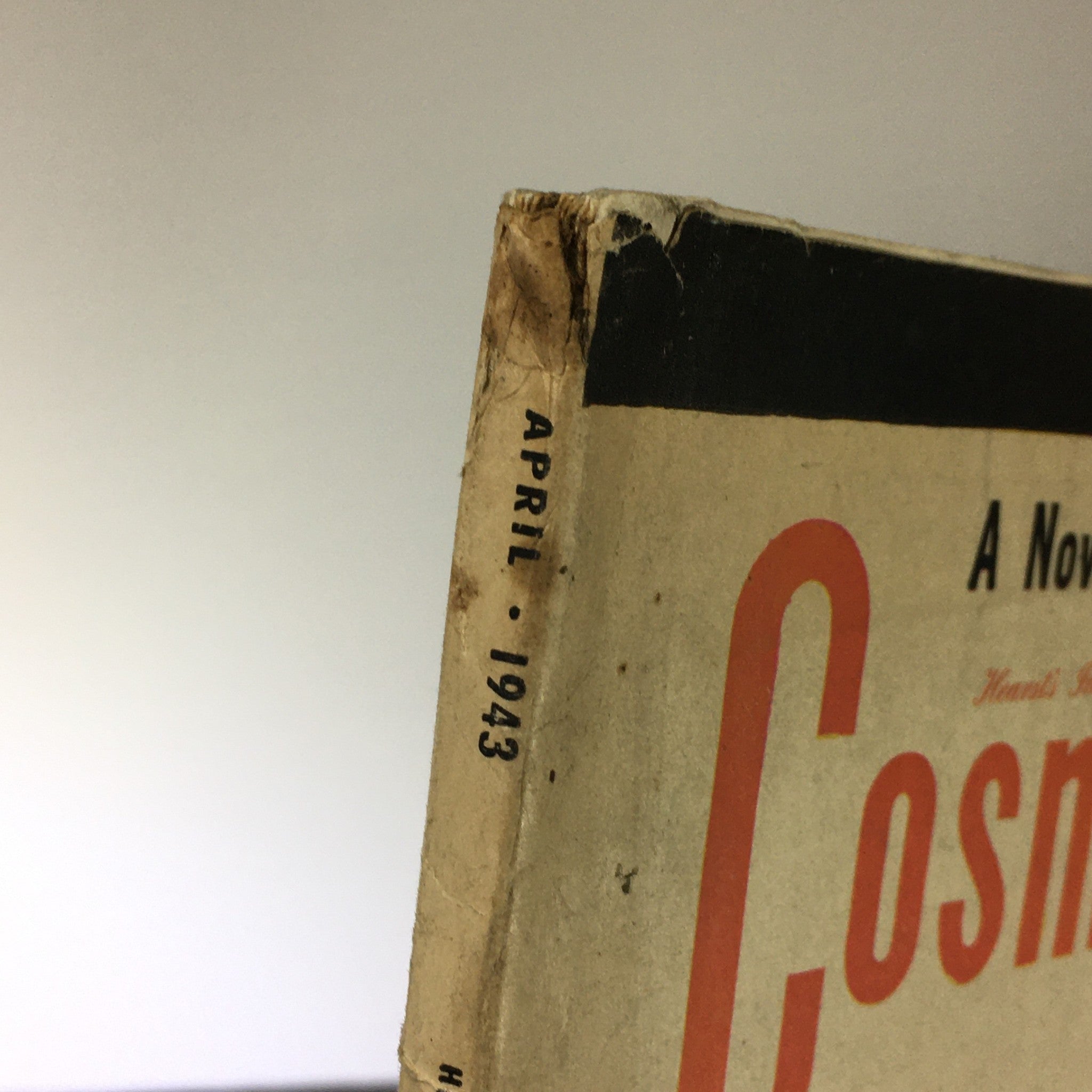 Side view of the spine of the VTG Cosmopolitan Magazine April 1943, highlighting the date 'April 1943' printed on the edge, indicative of vintage magazine condition.