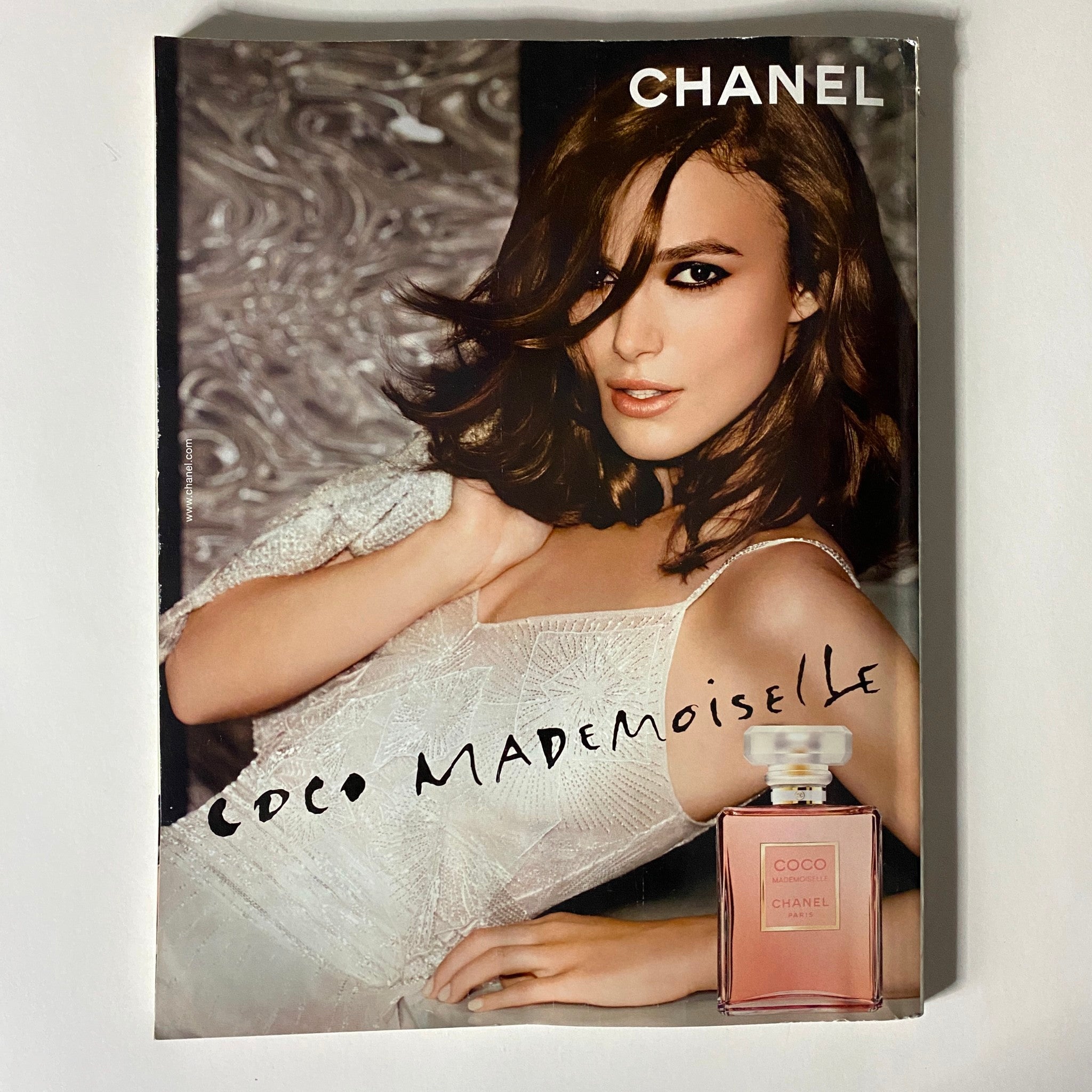 Chanel advertisement featuring a model promoting Coco Mademoiselle perfume, showcased in British Vogue UK Magazine February 2016.