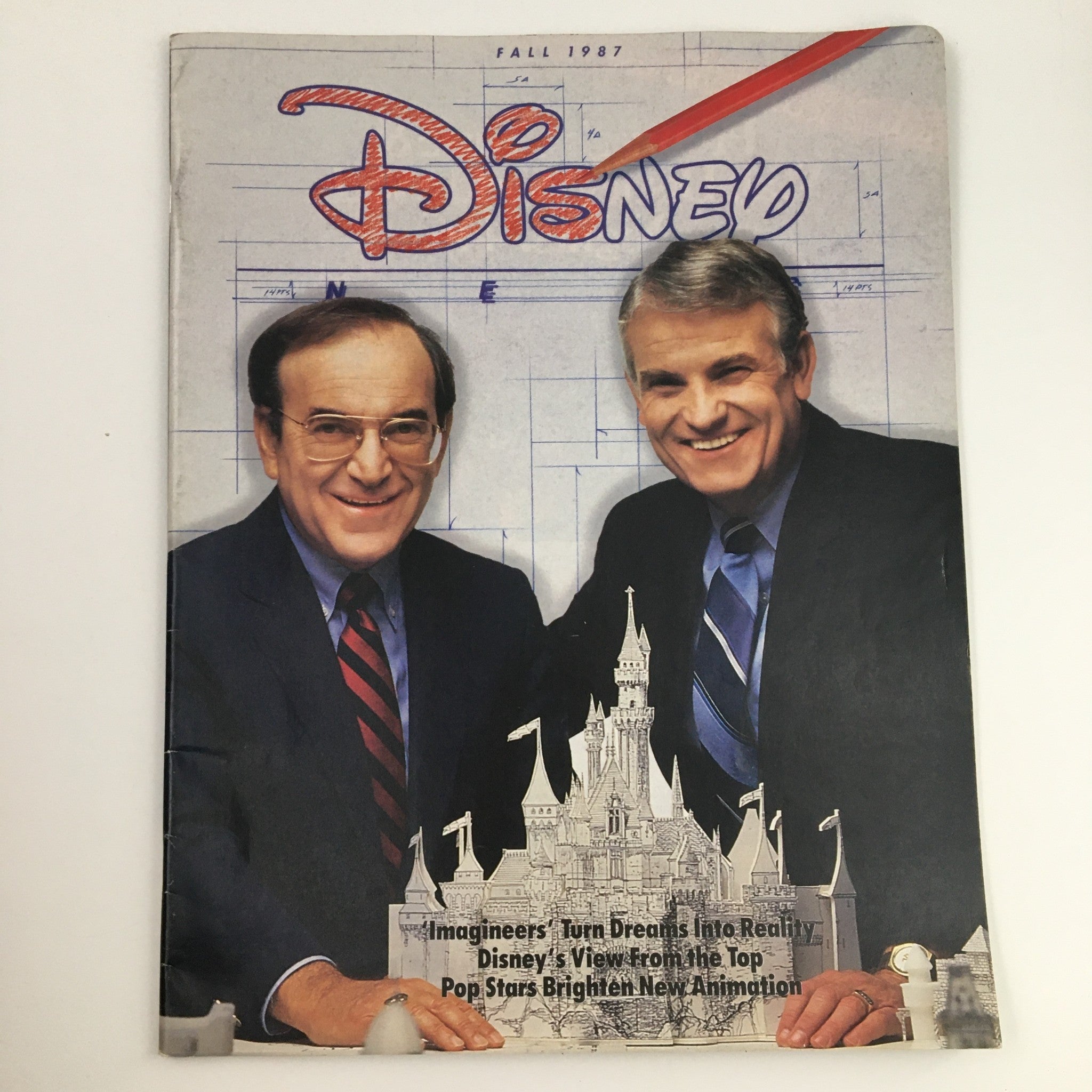 Cover of the Disney News Magazine Fall 1987 featuring two men smiling, celebrating Disney's Idea Factory's 35th anniversary of creativity.